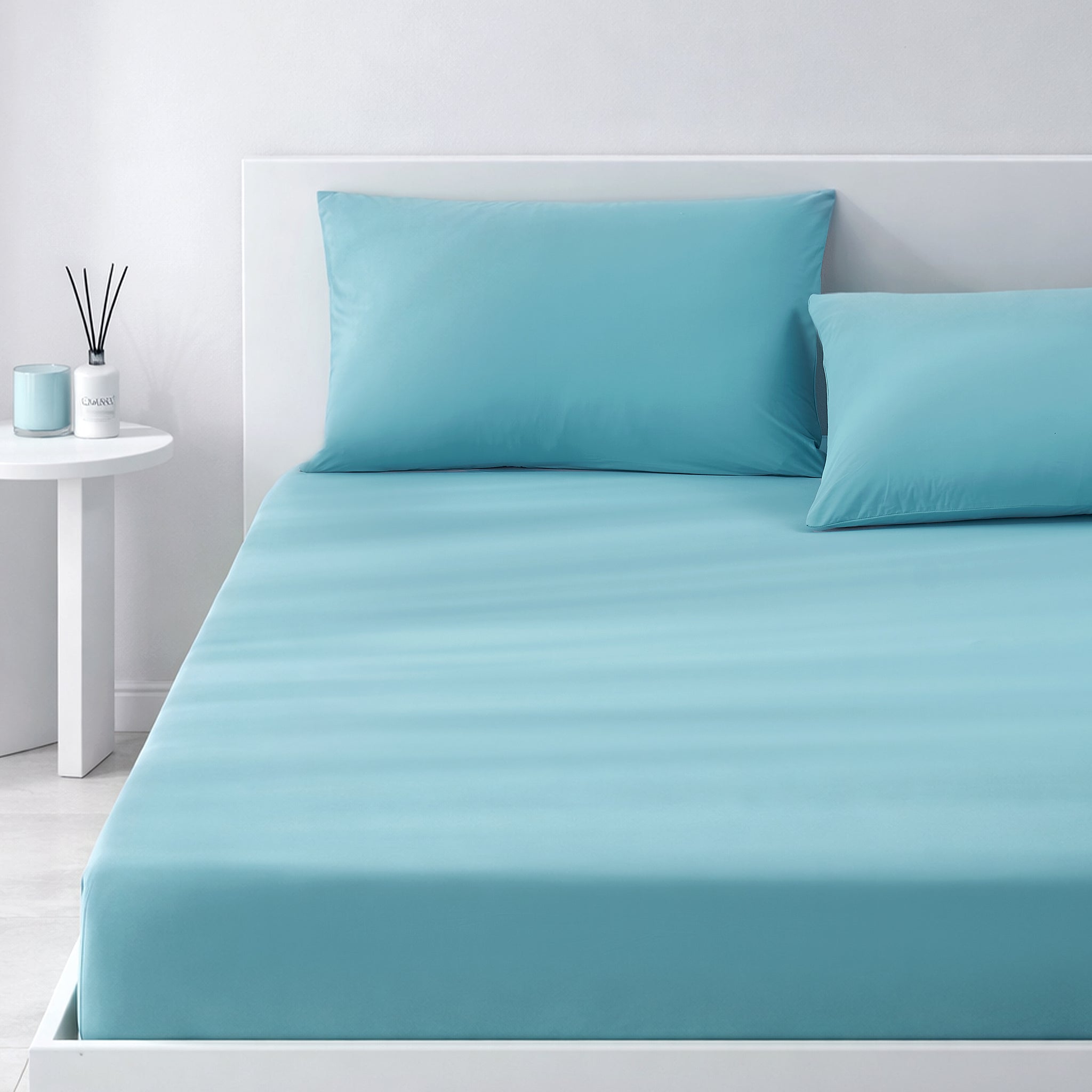Blue cooling bedding set on a bed in a minimalistic bedroom setting.#color_Dream Blue