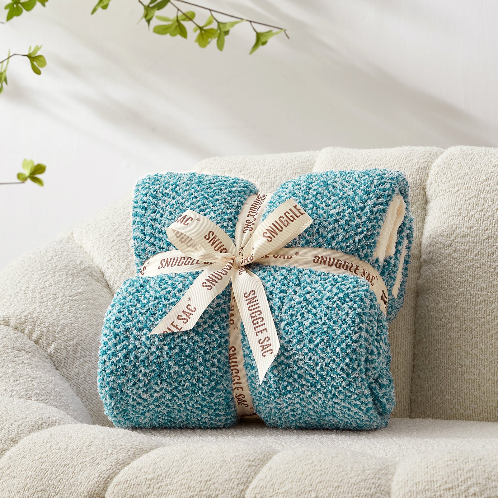 Heather Feather Yarn Throw Blanket in heather teal neatly folded with ribbon, a perfect gift idea for holidays, housewarming or special occasions. #Color_Heather Teal
