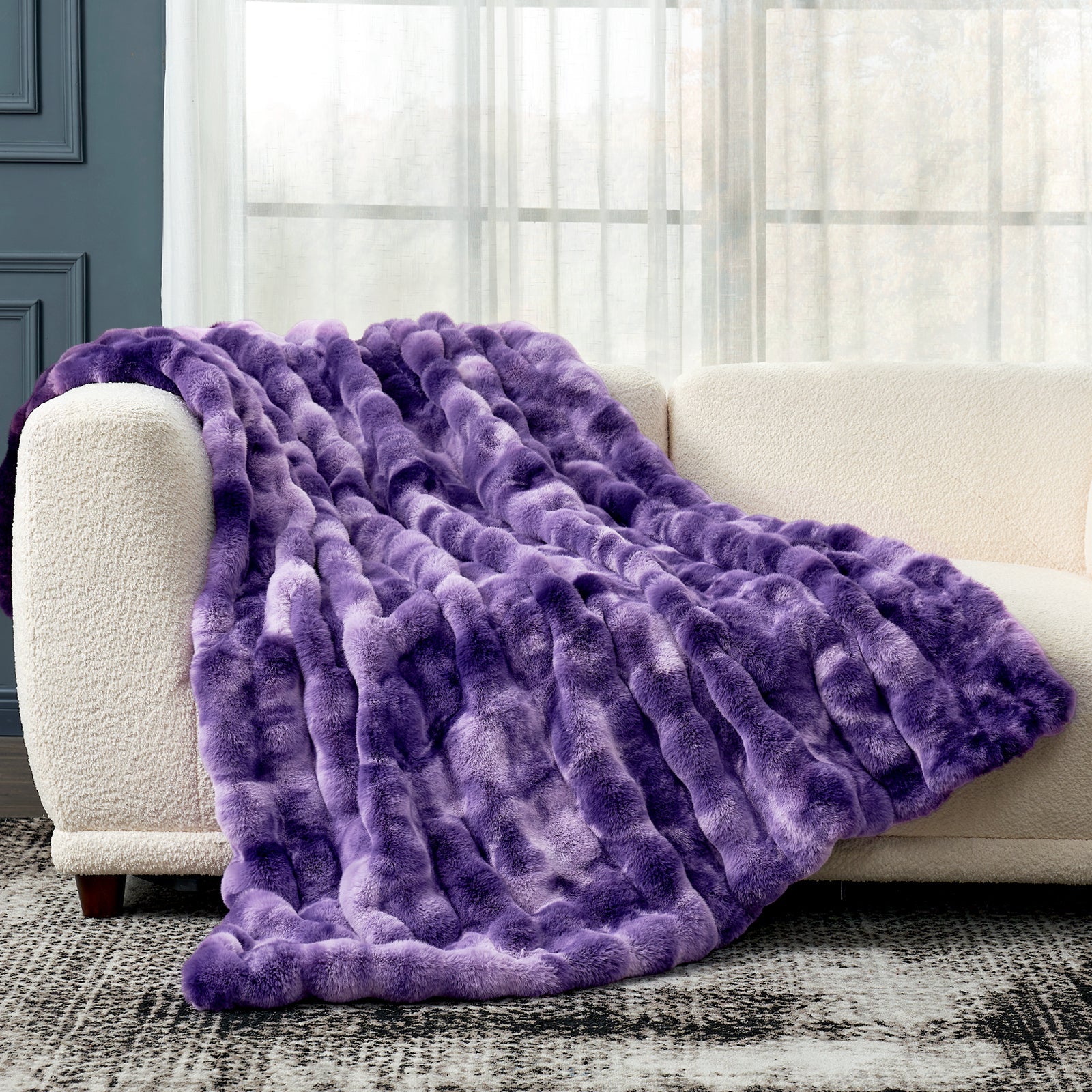 Cozy Bliss Bubble Faux Fur Throw Blanket, purple tie-dye, draped over a sofa for cozy comfort #color_Tie-dye Purple
