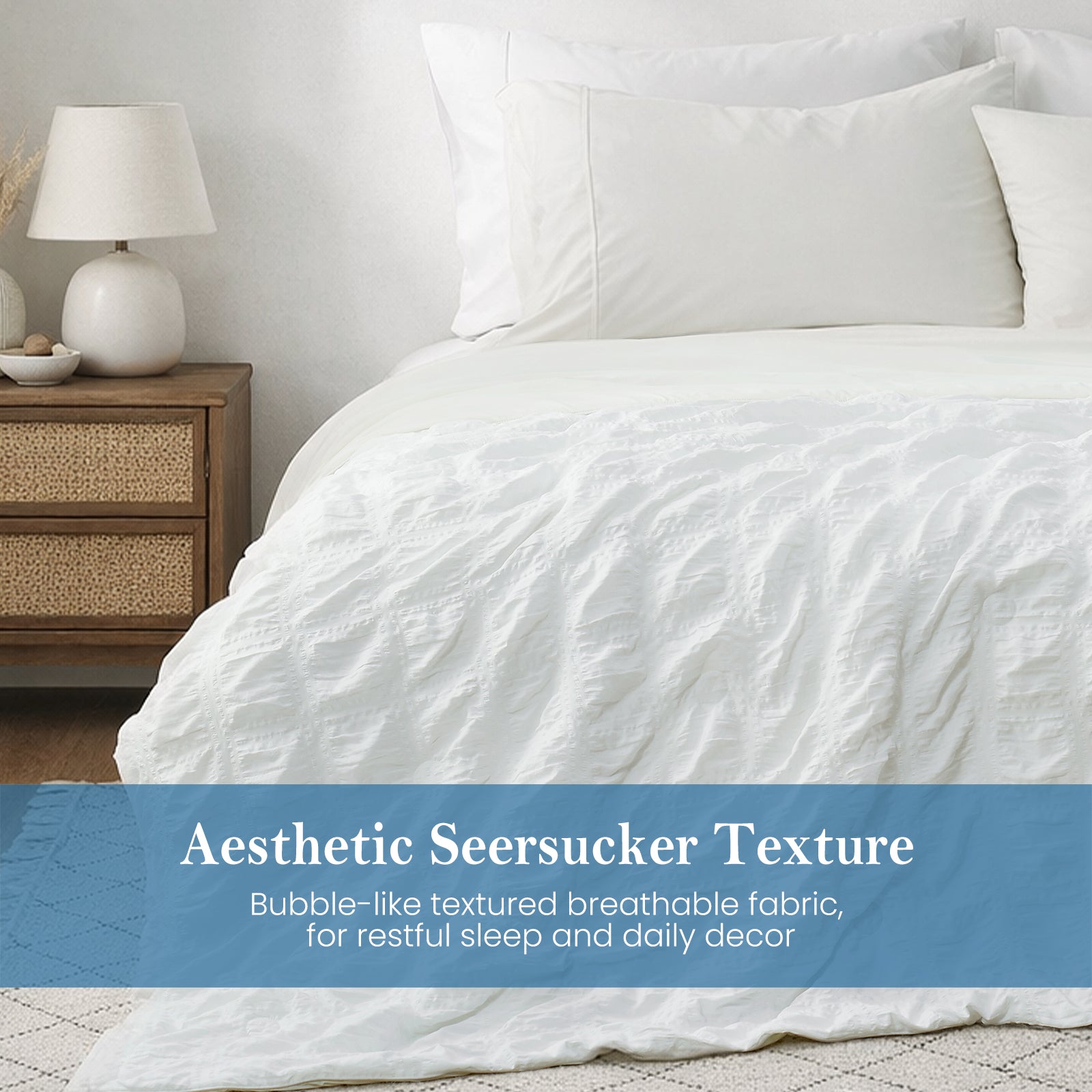 Close-up of white seersucker comforter, textured breathable fabric with soft cooling touch.#Color_White Plaid