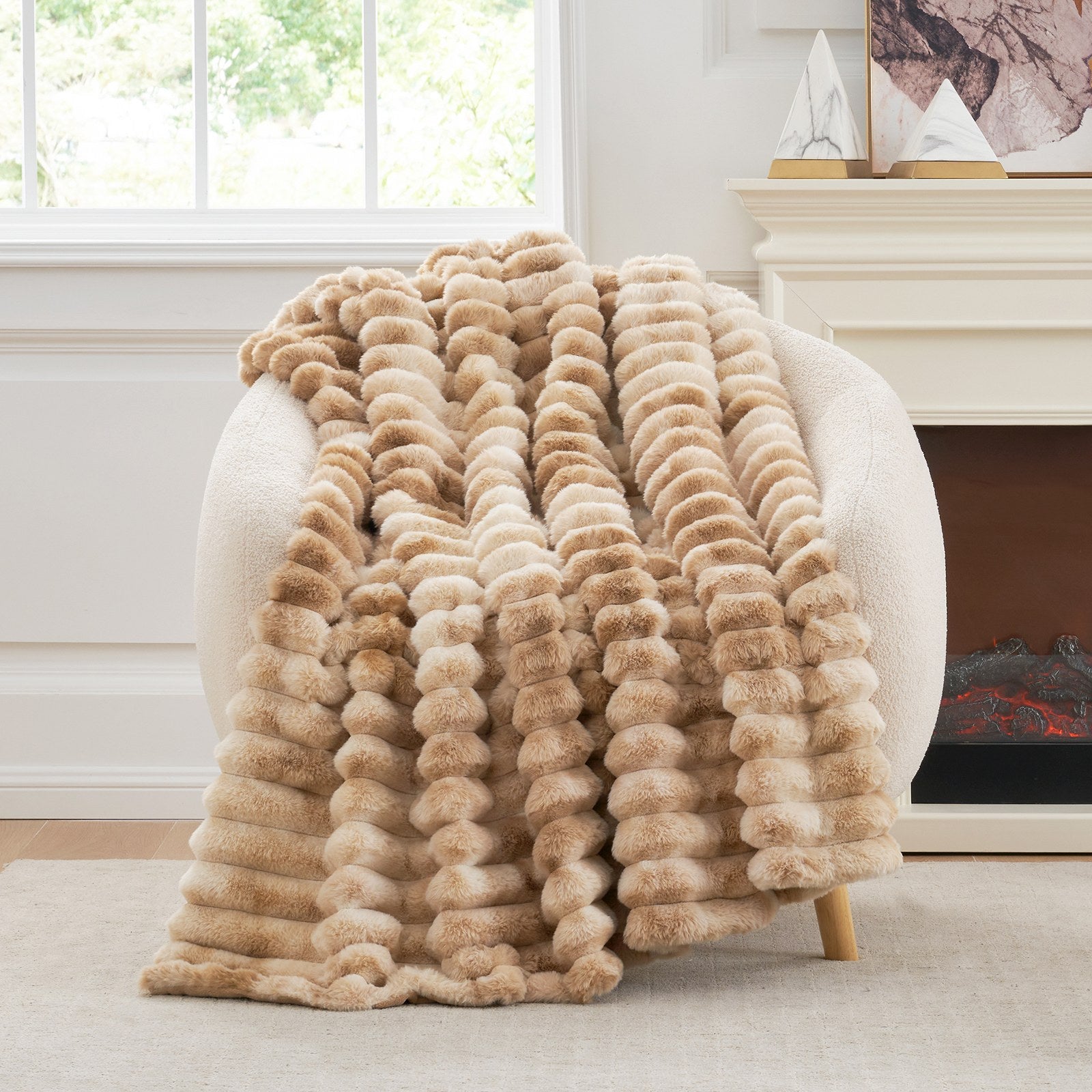 Striped faux fur throw blanket in beige draped over a cozy chair. Luxurious and soft. #color_Tie-dye Khaki