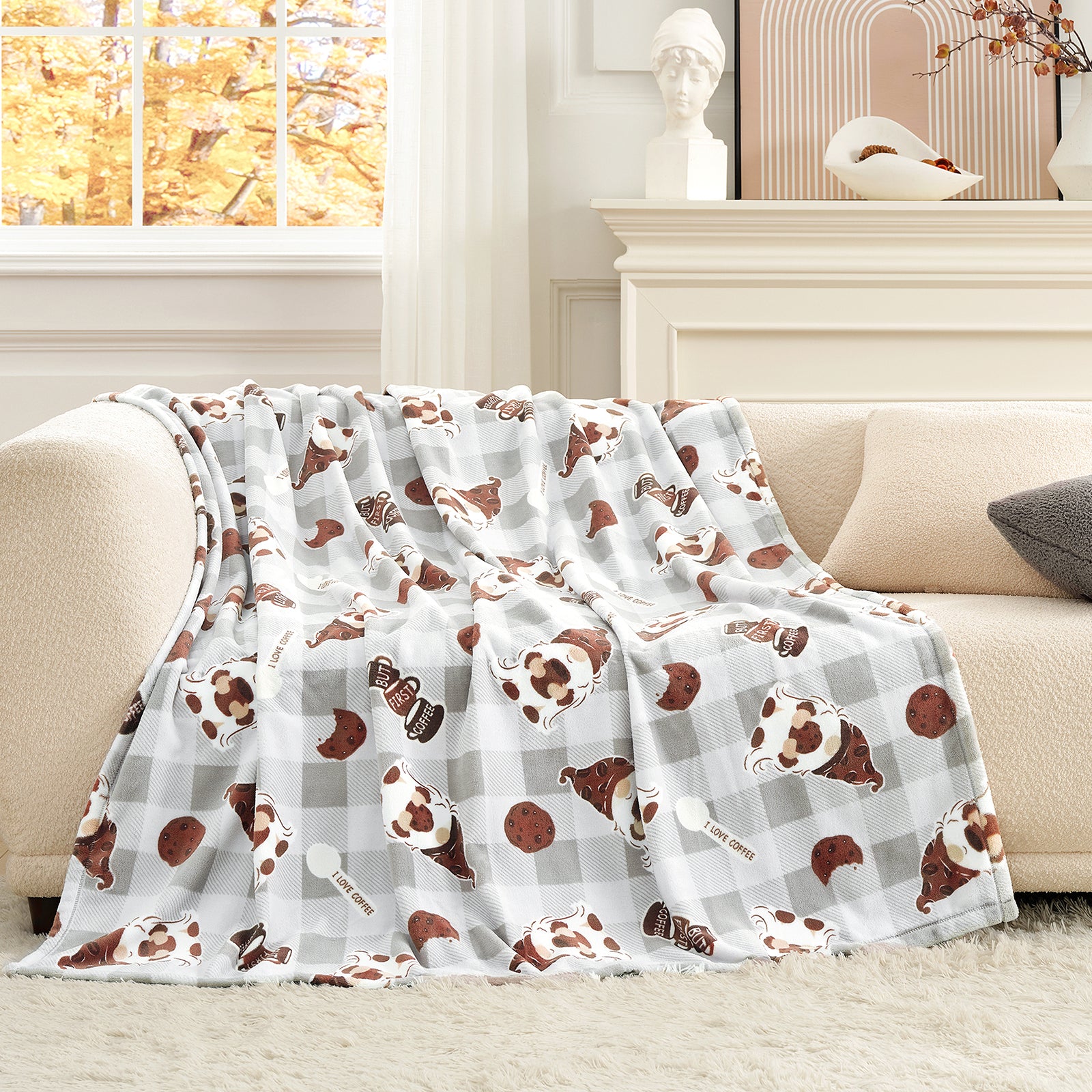 Flannel blanket with dog pattern draped over a couch in a living room. #color_Coffee Gnome Grey