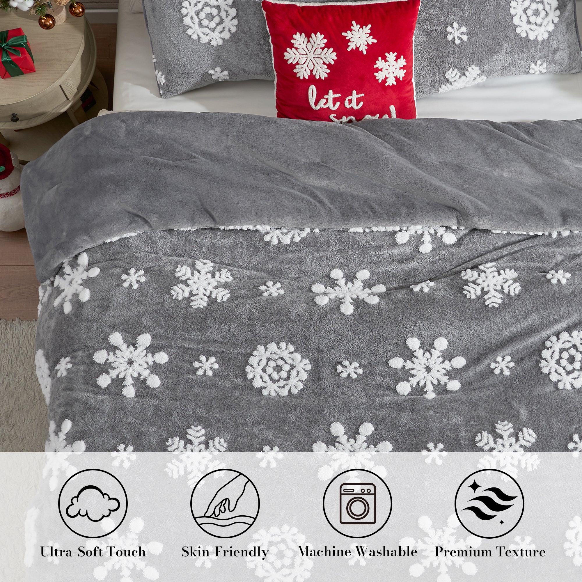 Gray comforter with snowflake pattern on a bed, featuring Christmas-themed pillows. #Color_Snowflake Grey