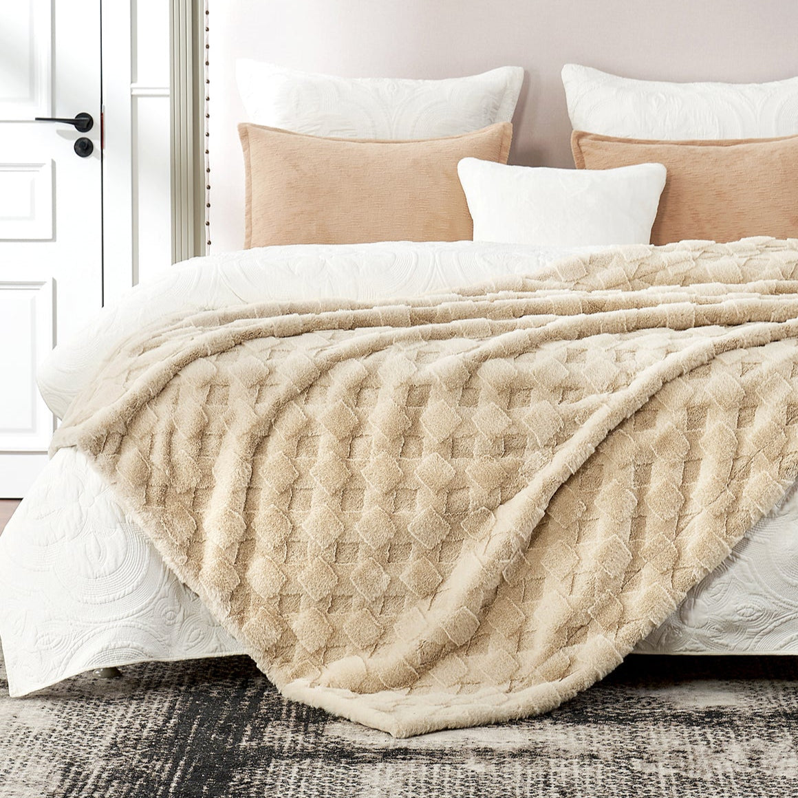 Neatly made bed with beige quilt and pillows in a bedroom setting #color_Beige