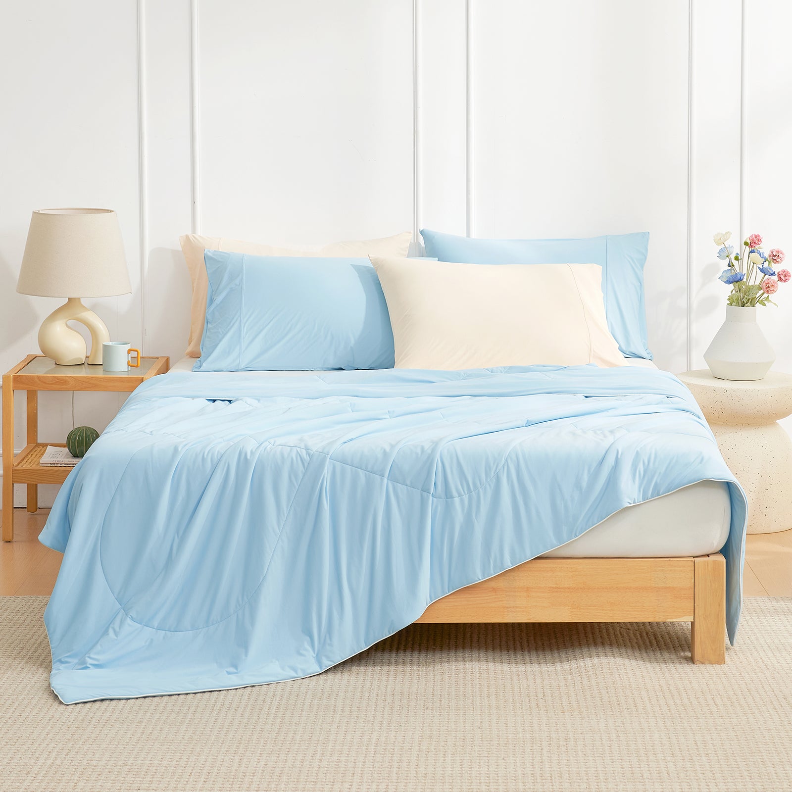Cozy Bliss light blue cooling comforter on bed, breathable and soft, perfect for hot sleepers #Color_Sky Blue