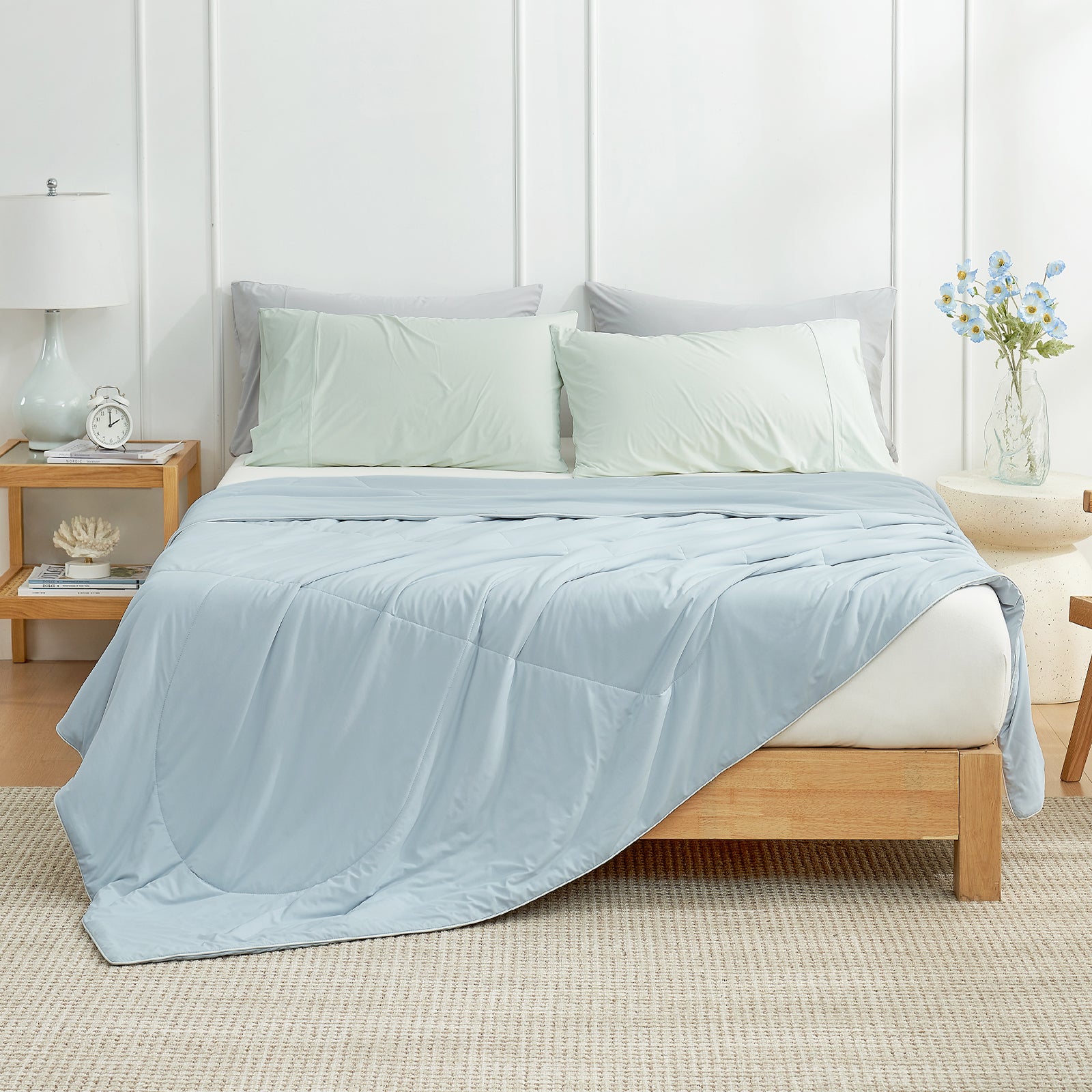Cozy Bliss blue cooling blanketon bed, perfect for summer #Color_Blue