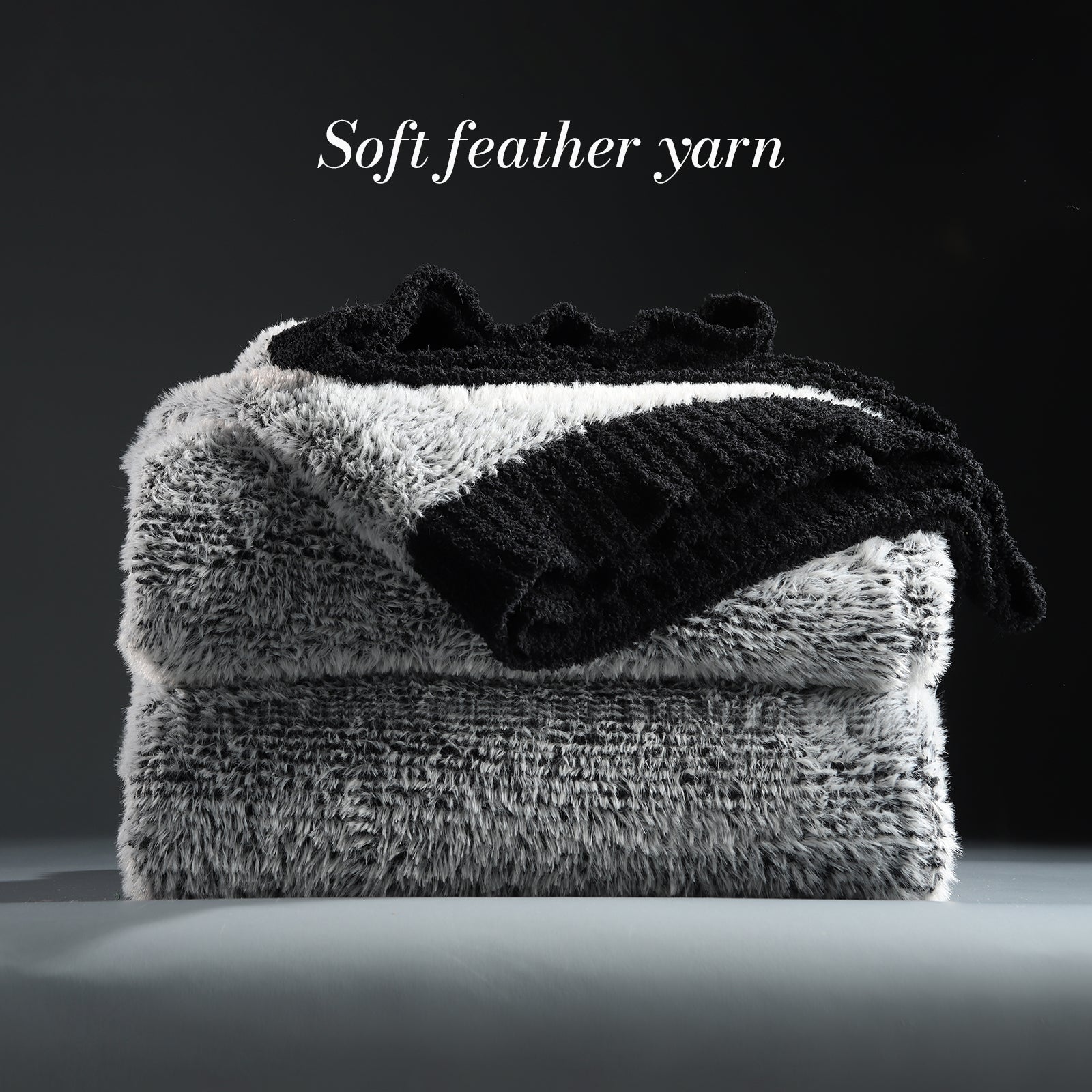 Faux Mink Feather Knit Throw Blanket in Black neatly folded stack, showcasing soft feather yarn and premium texture. #color_Black