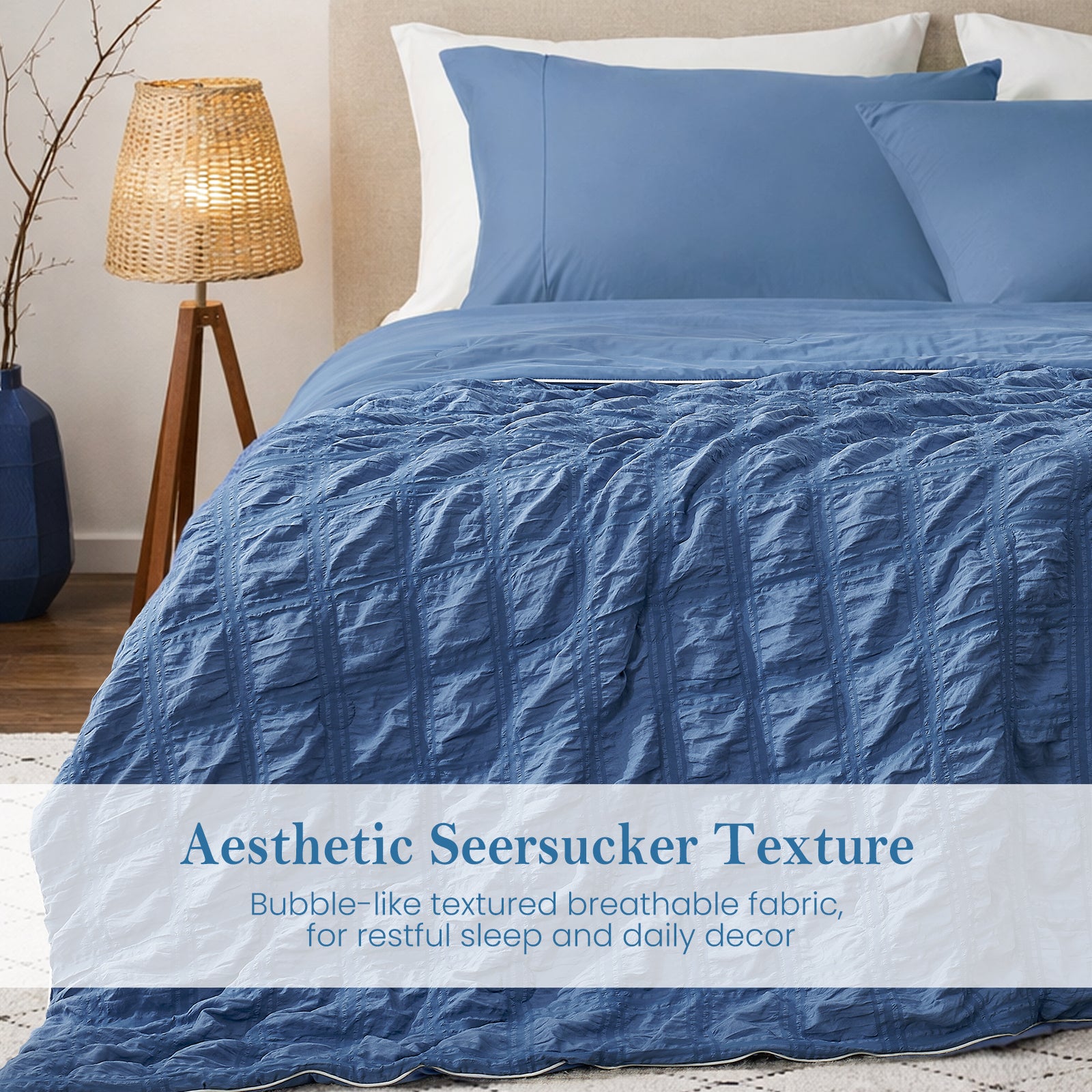 Close-up of denim blue seersucker comforter, textured breathable fabric with soft cooling touch.#color_Denim Blue