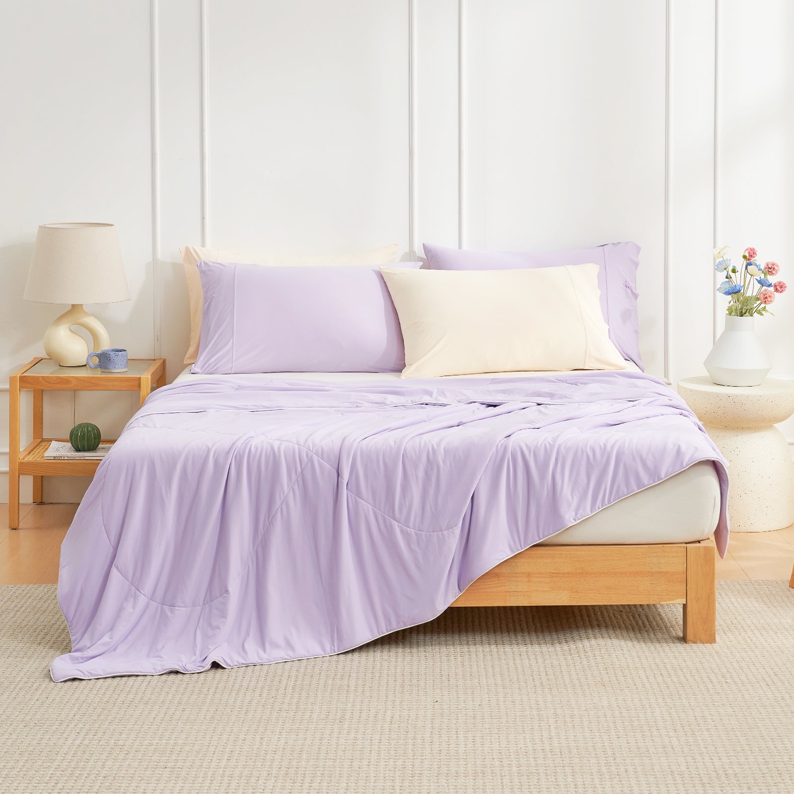 Cozy Bliss purple cooling comforter on bed with pillows, breathable bedding for hot sleepers. #Color_Purple