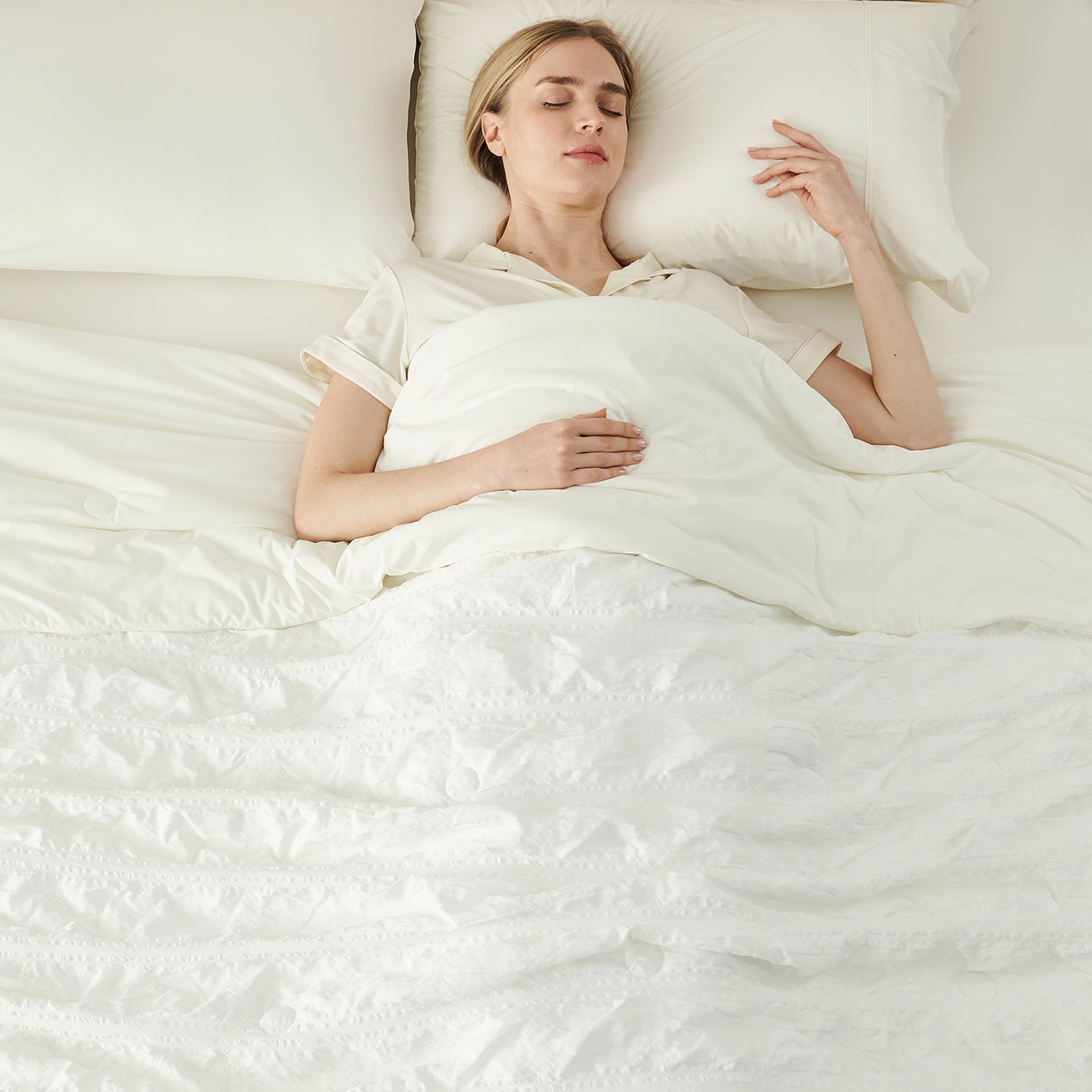 Woman sleeping peacefully with cooling comforter, cozy bedding #Color_White Plaid