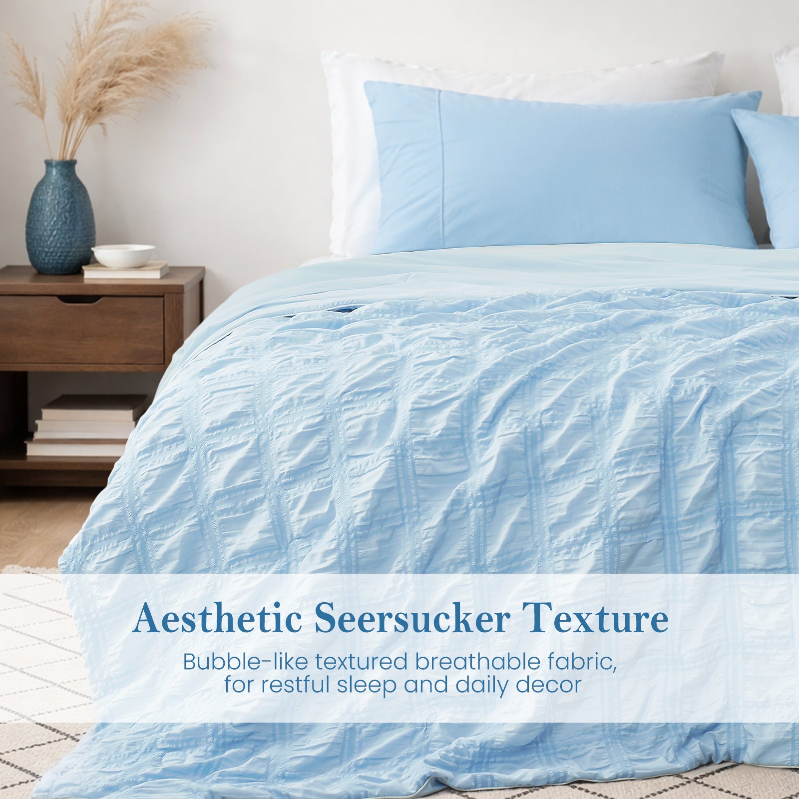Close-up of blue seersucker comforter, textured breathable fabric with soft cooling touch.#Color_Blue Plaid