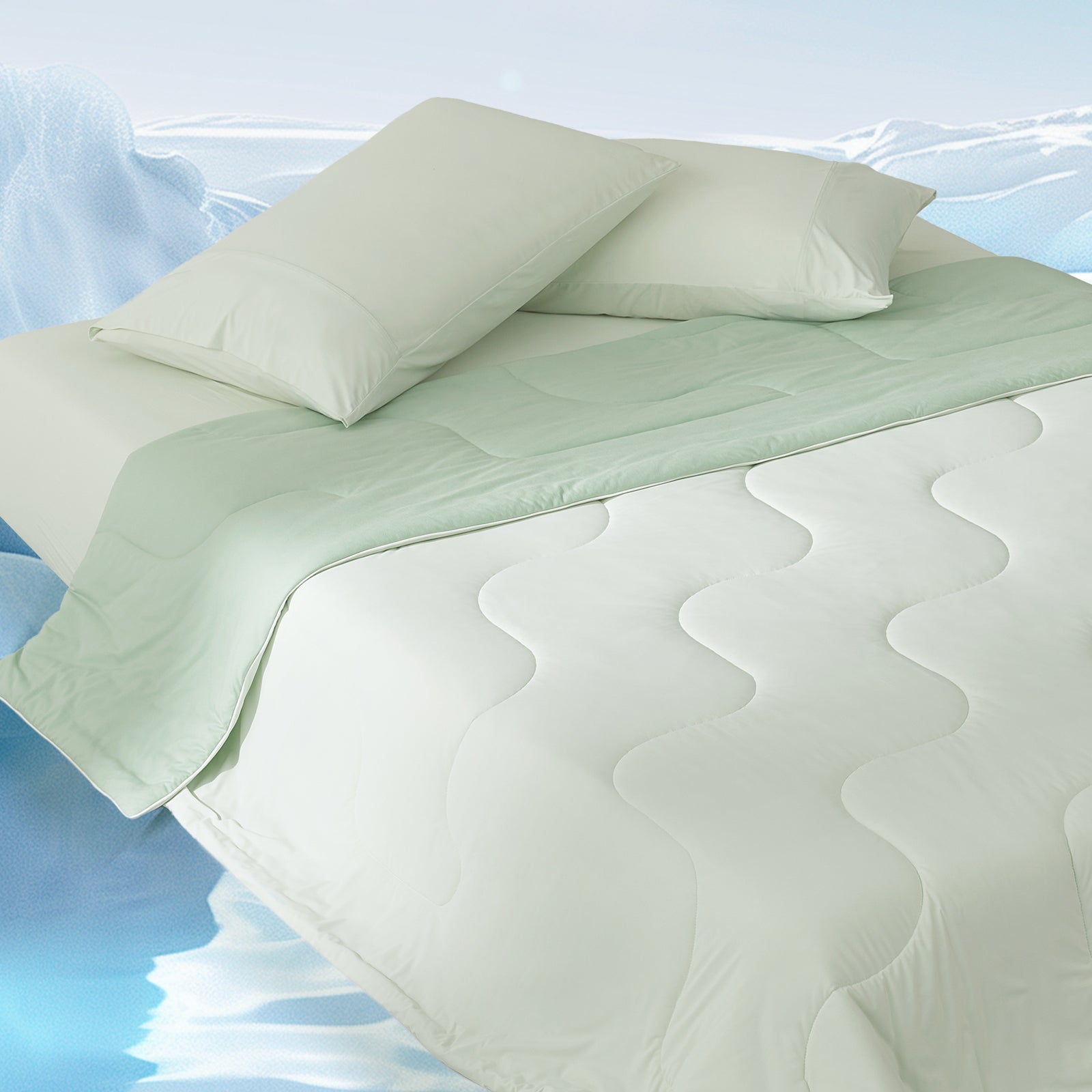 Cozy Bliss cooling comforter on a bed, showcasing breathable and lightweight design for hot sleepers. #color_Mint Green