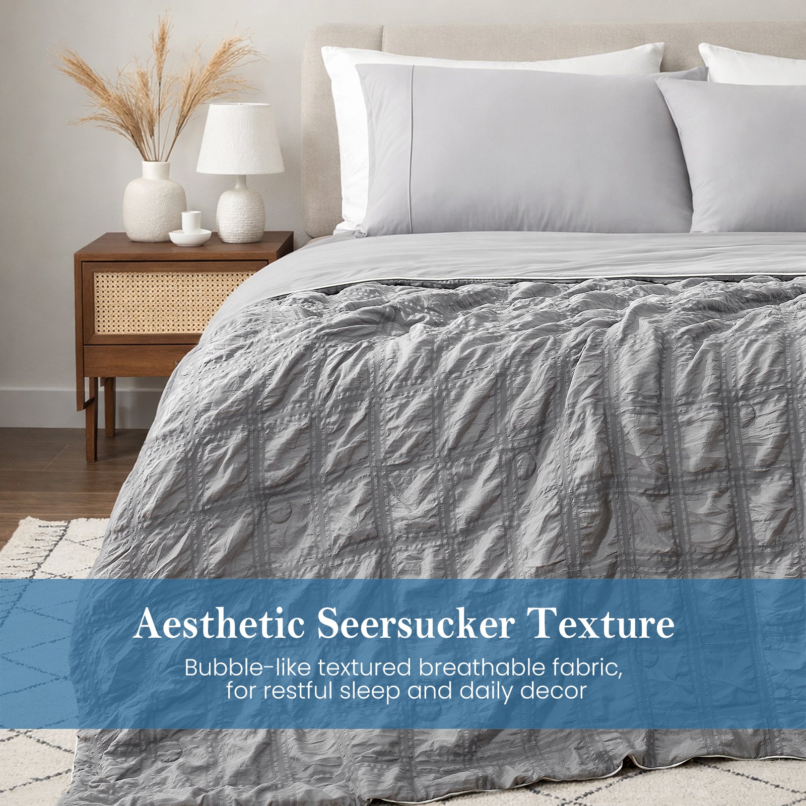 Close-up of dark gray seersucker comforter, textured breathable fabric with soft cooling touch.#color_Dark Grey