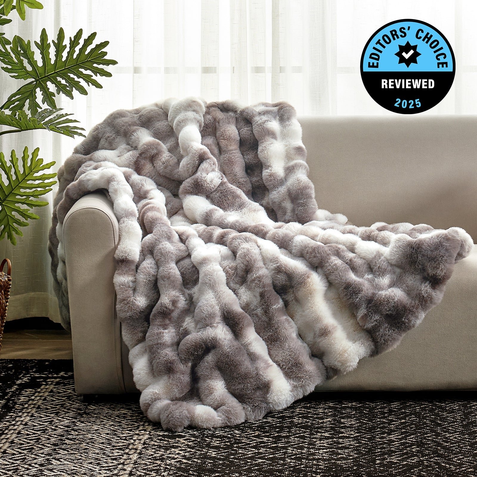 Fluffy gray and white blanket draped over a sofa with an 'Editors' Choice' badge in the corner. #Color_Tie-dye Taupe