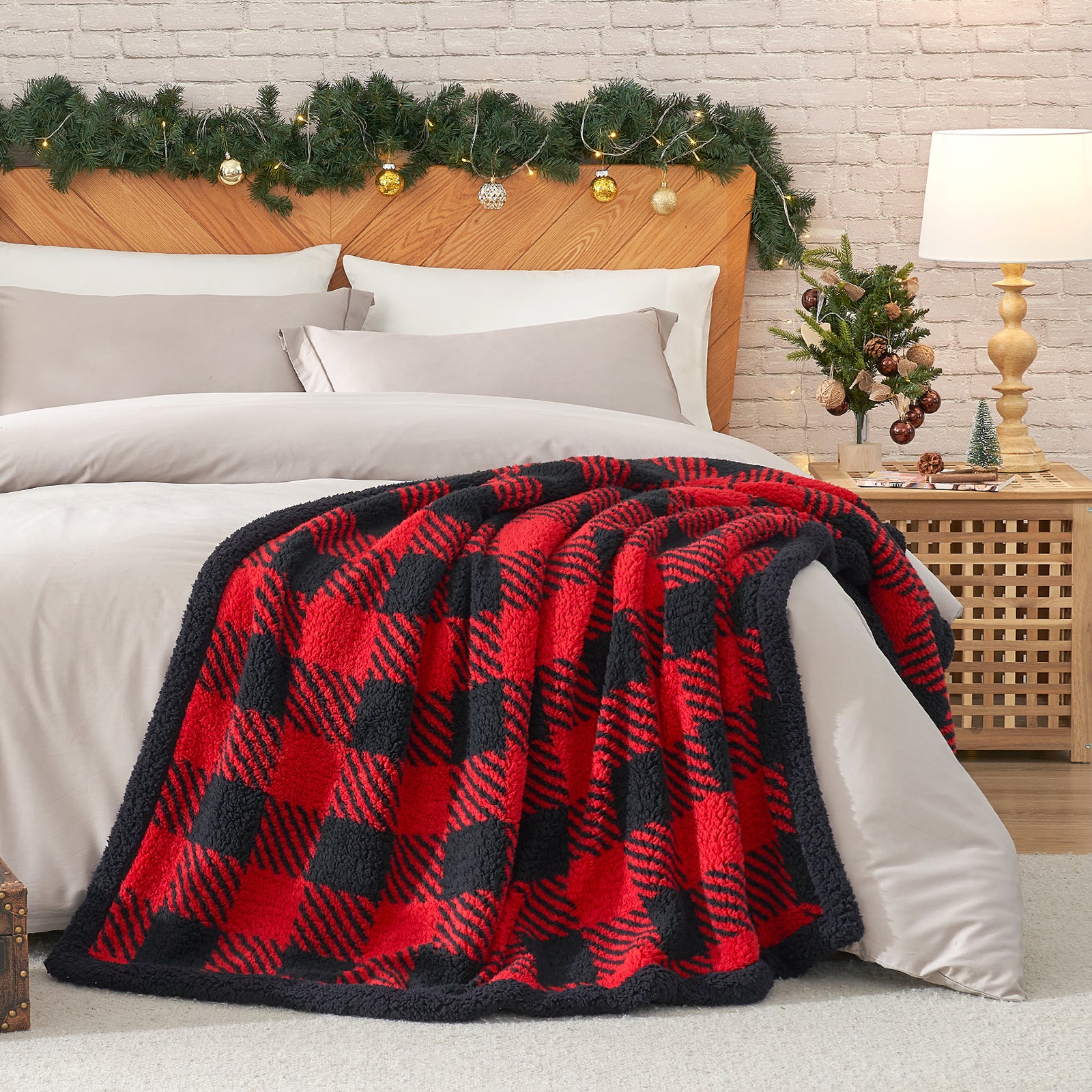 Red and black checkered blanket draped over a bed with festive decorations. #Color_Red/Black Buffalo Check