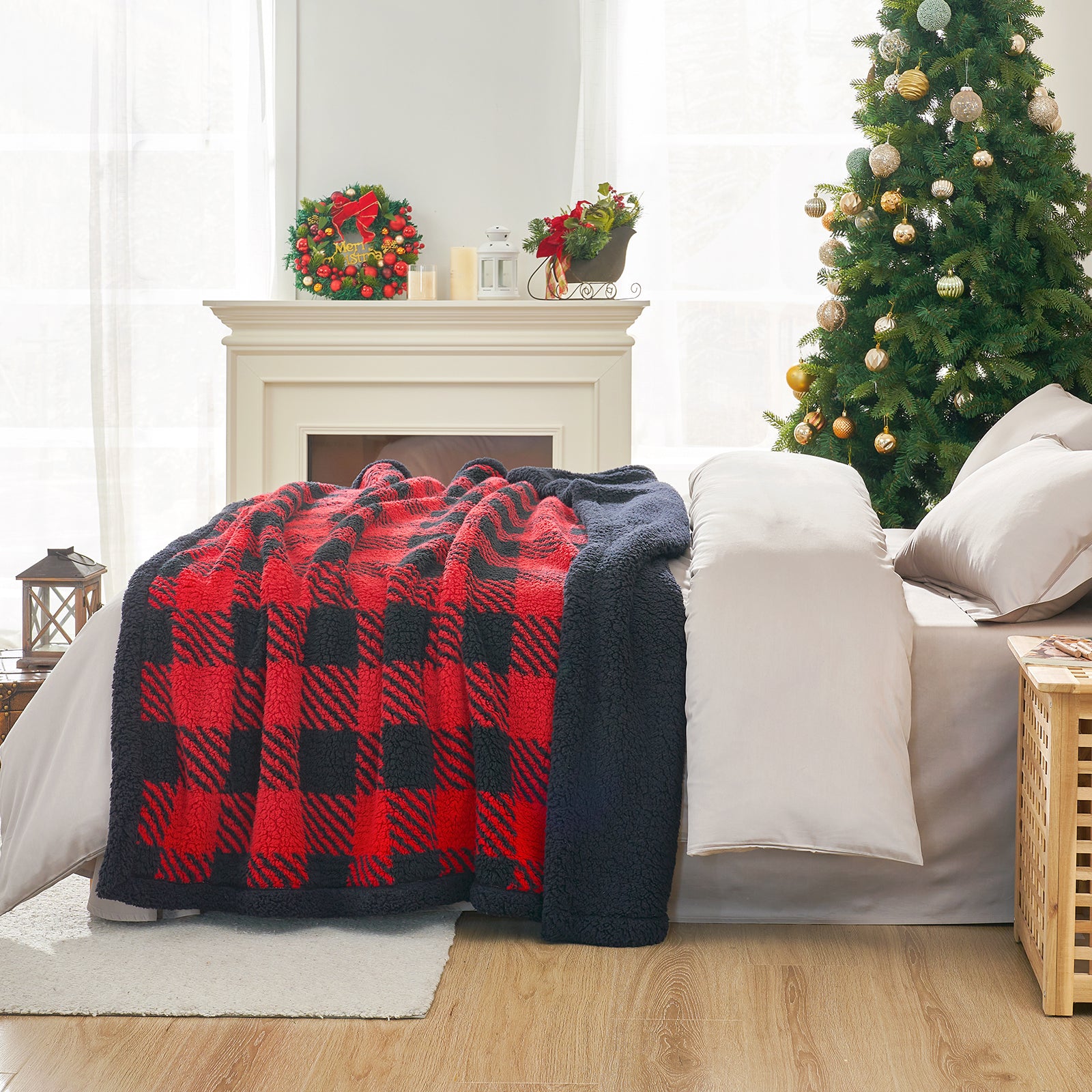 Red and blue plaid blanket draped over a white sofa in a living room with a Christmas tree and fireplace. #Color_Red/Black Buffalo Check