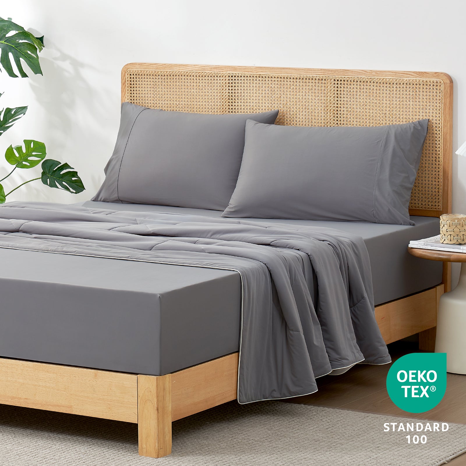 Gray cooling sheet set on bed with pillowcases. Ultra-soft and breathable, Oeko-Tex certified cozy bedding #Color_Dark Grey