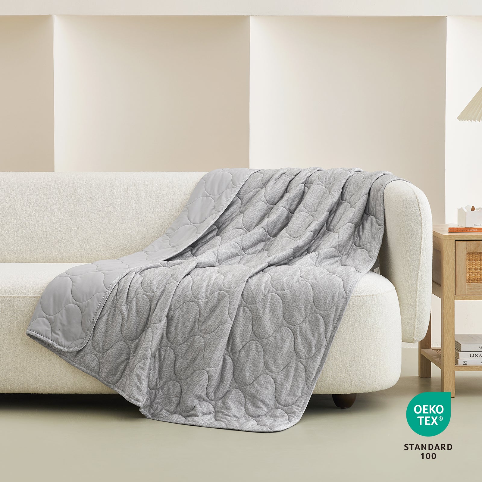 Gray cooling blanket on a white sofa, cloud pattern, OEKO-TEX #color_Silver Grey