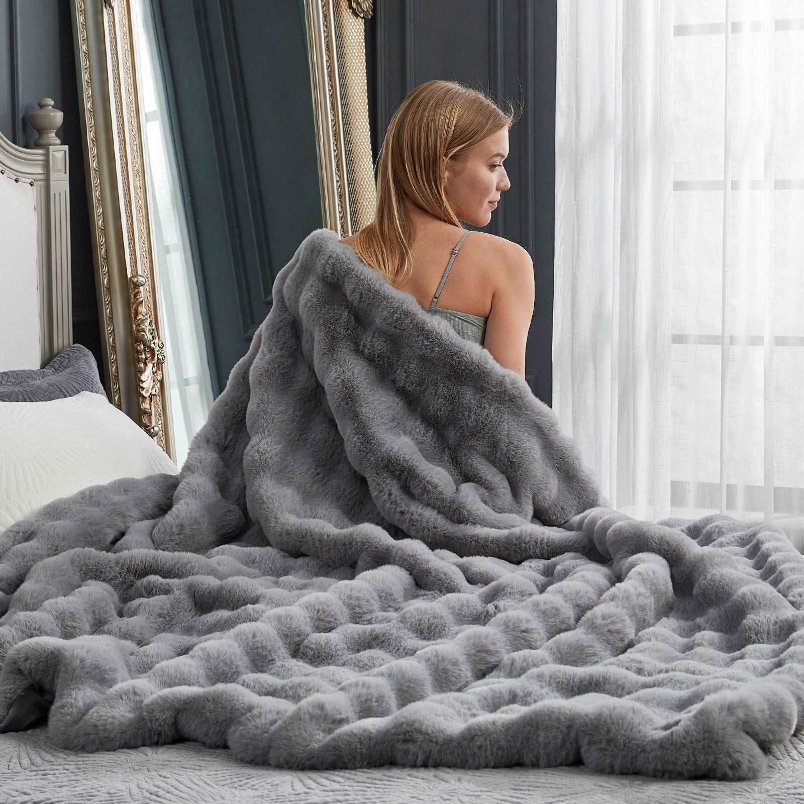 Woman with gray Bubble Faux Fur Throw Blanket - Cozy Bliss #color_Light Grey