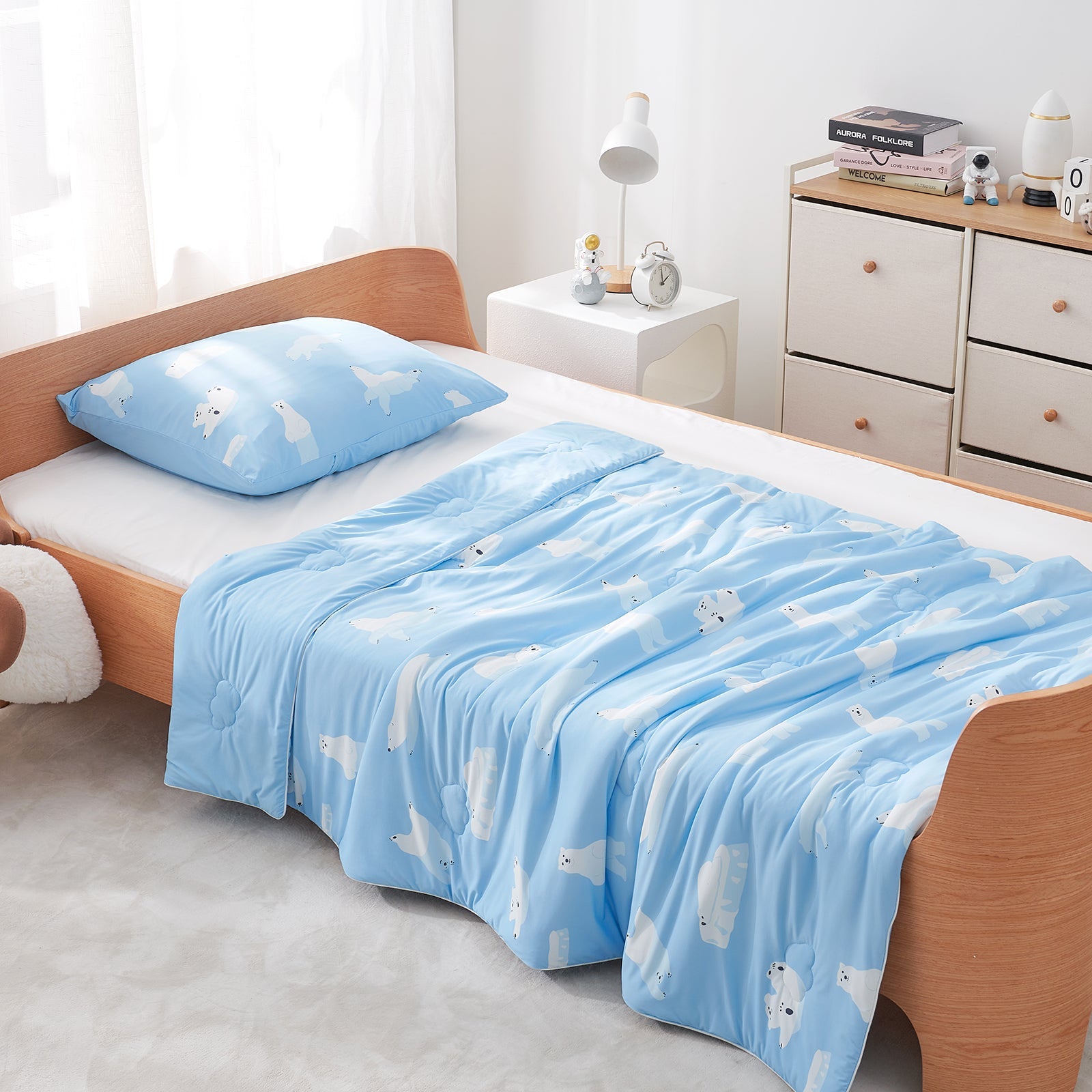 Blue comforter and pillows in a bedroom setting#color_Polar Bear