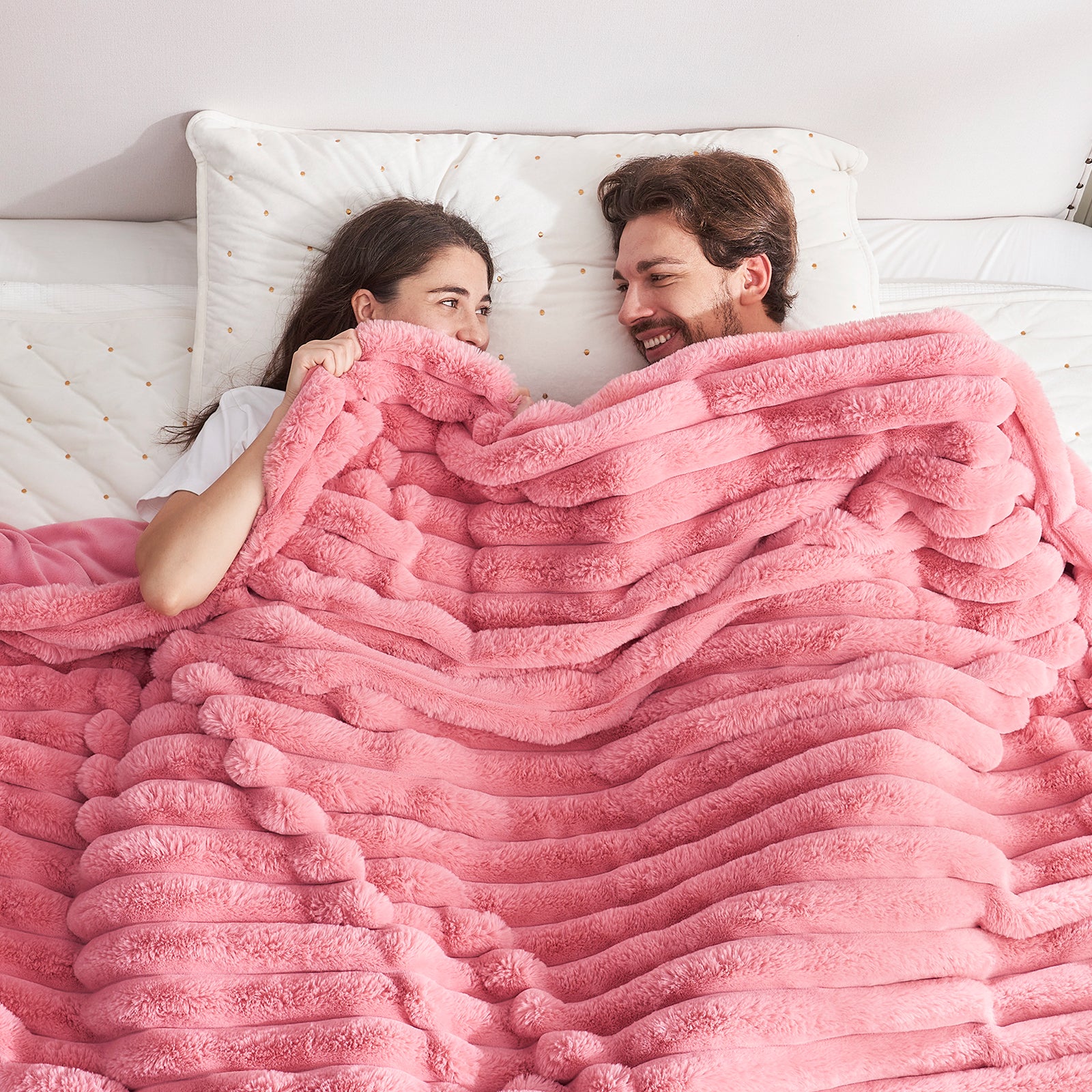 Couple under Cozy Bliss pink striped faux fur blanket. Soft, cozy bedding. #color_Hot Pink