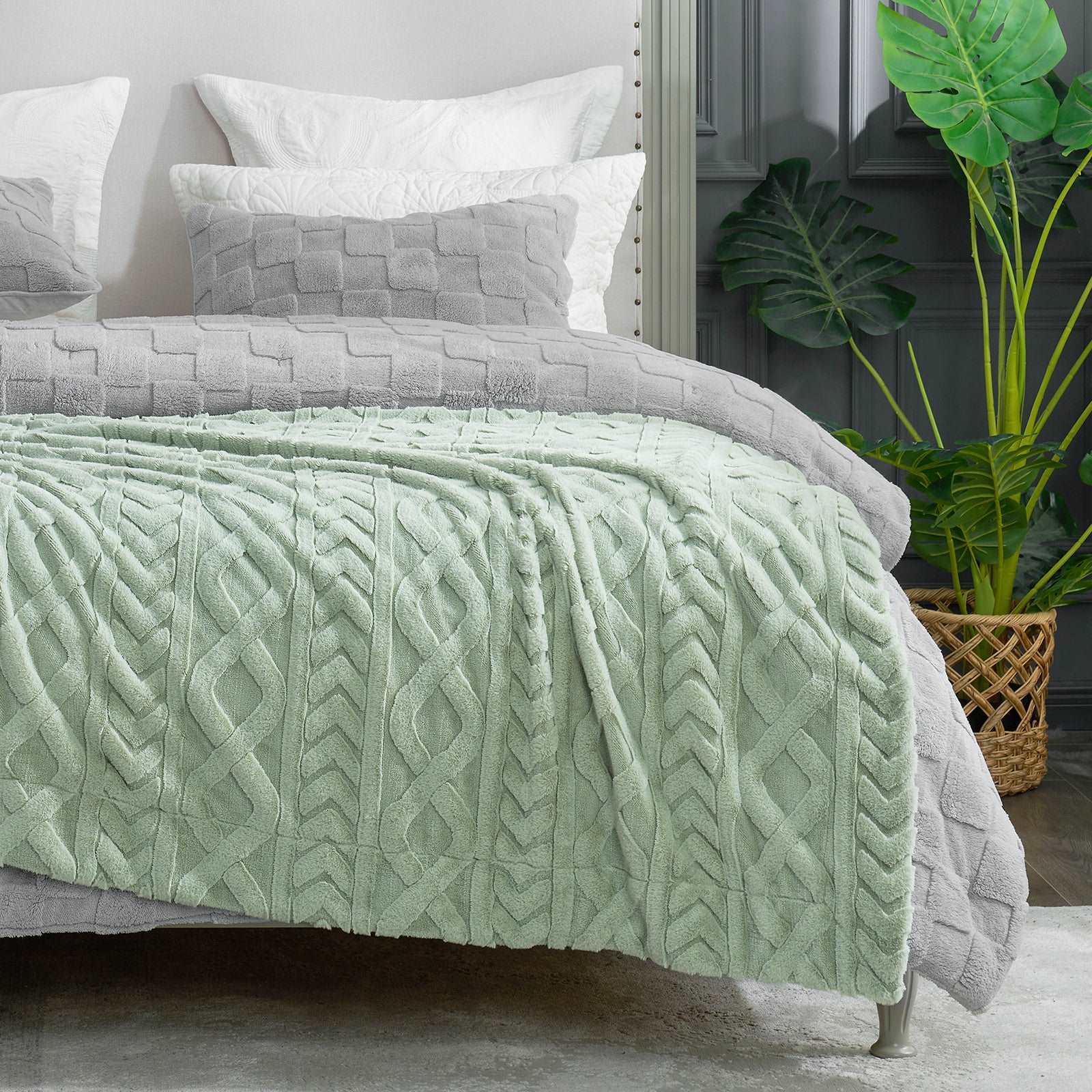 Cozy Bliss green cable knit blanket on bed, cozy bedding #color_Sage Green