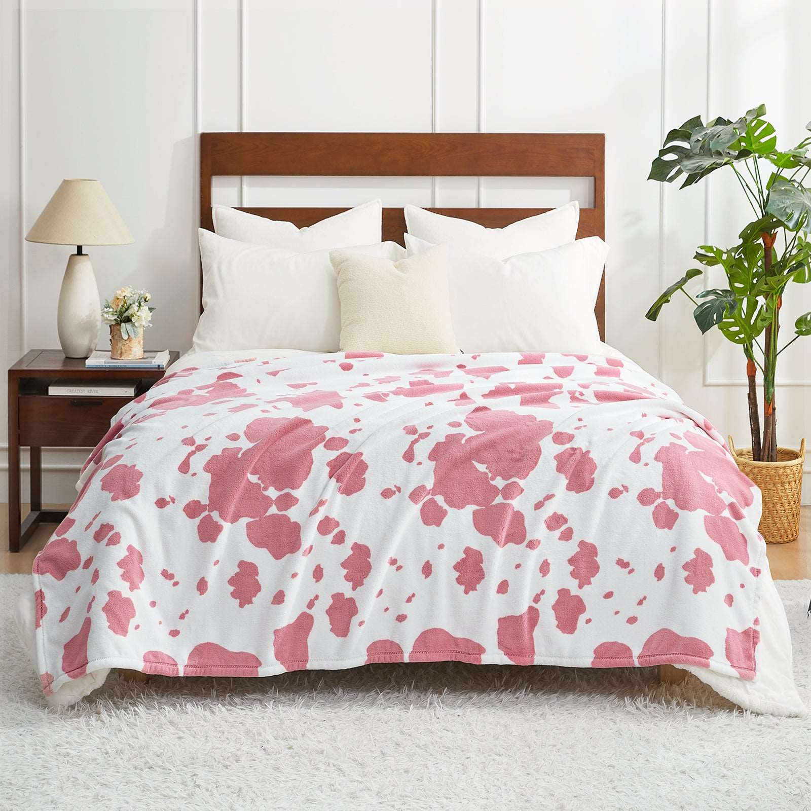 Pink Cow Print Blanket on Bed #color_Strawberry