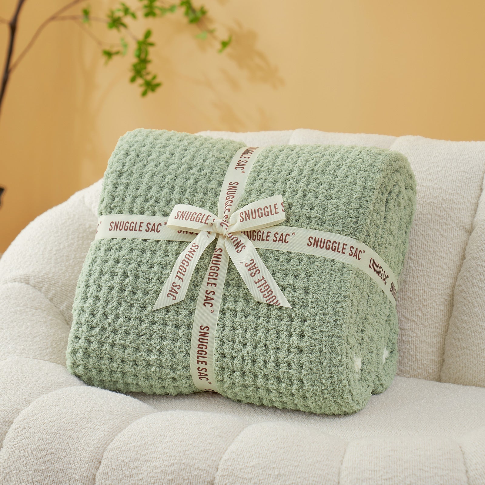 Soft Waffle Feather Yarn Throw Blanket in Sage Green neatly folded as gift packaging, ideal for gifting occasions. #color_Sage Green
