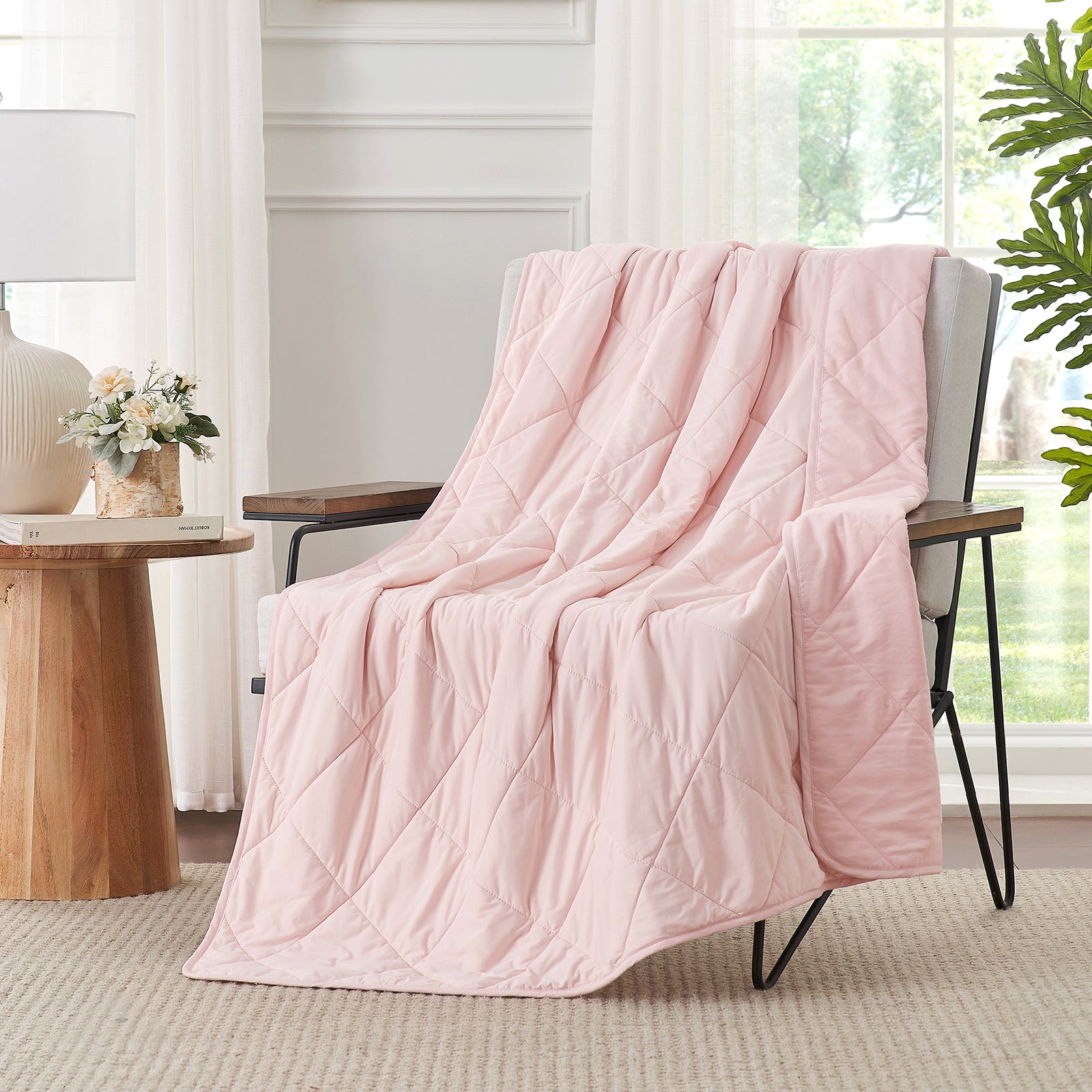 Cool pink Cozy Bliss Airflow Breathable Cooling Blanket draped over chair. #Color_Cool Pink