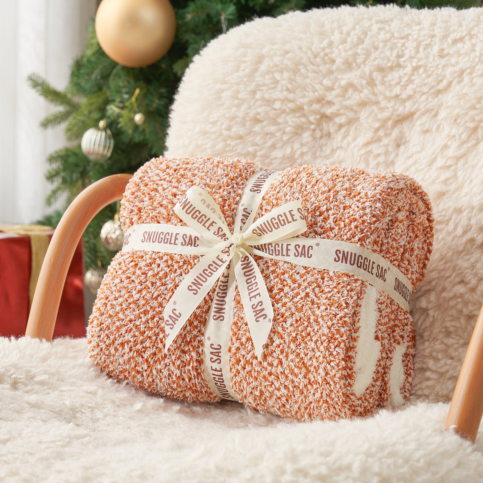 Heather Feather Yarn Throw Blanket in orange neatly folded with ribbon, a perfect gift idea for holidays, housewarming or special occasions. #Color_Orange
