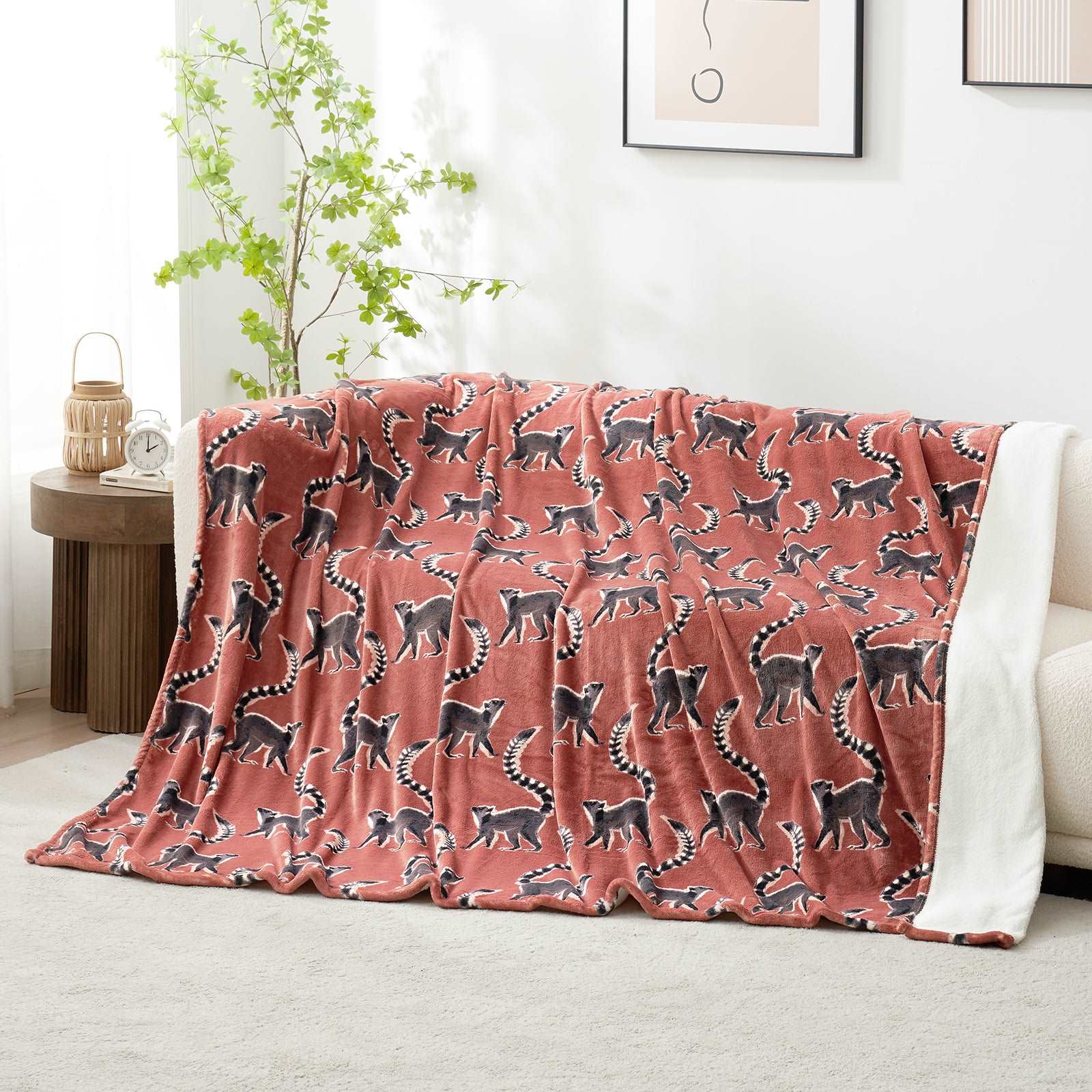 Lemur print fleece reversible blanket on a sofa #color_Proud Lemur
