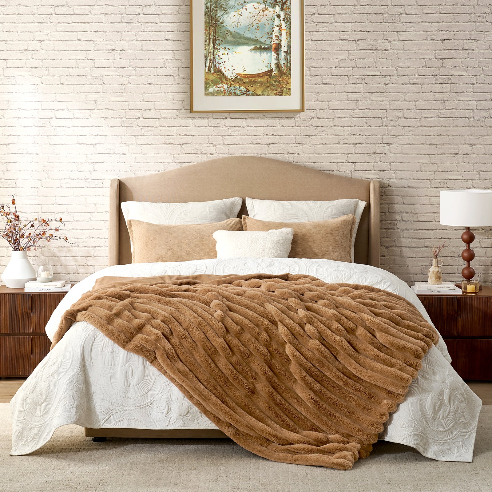 Bedroom with a bed featuring a brown blanket, white pillows, and a beige headboard. #color_Toasty Brown