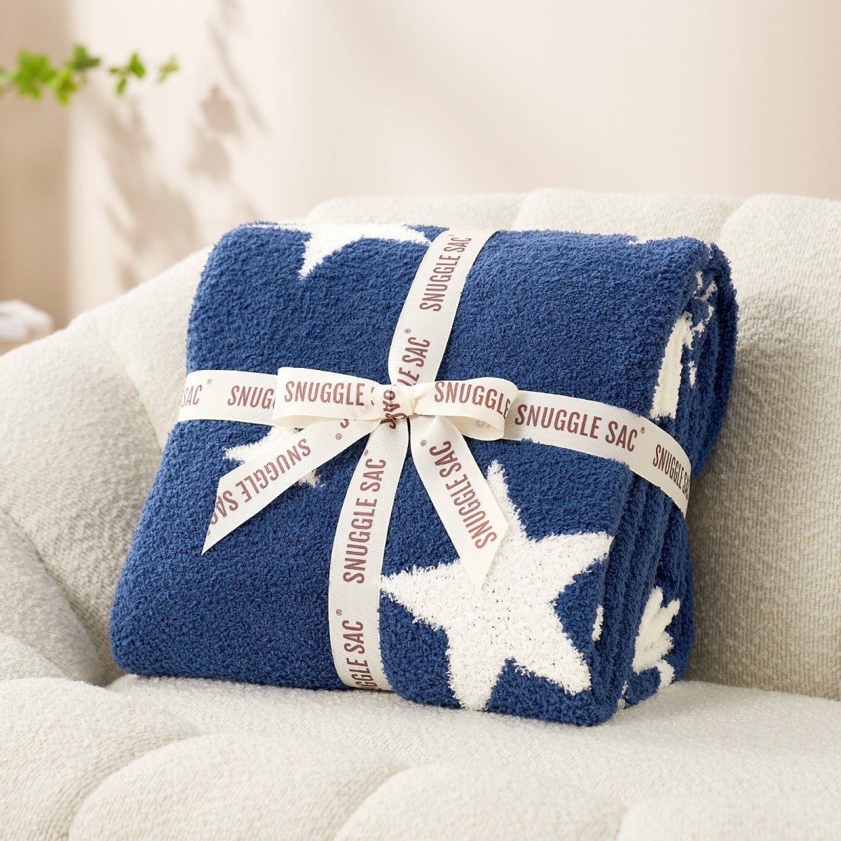 Reversible Star Feather Yarn Knit Throw Blanket in Navy Blue neatly folded with ribbon, perfect as a cozy gift for holidays and special occasions. #color_Navy Blue