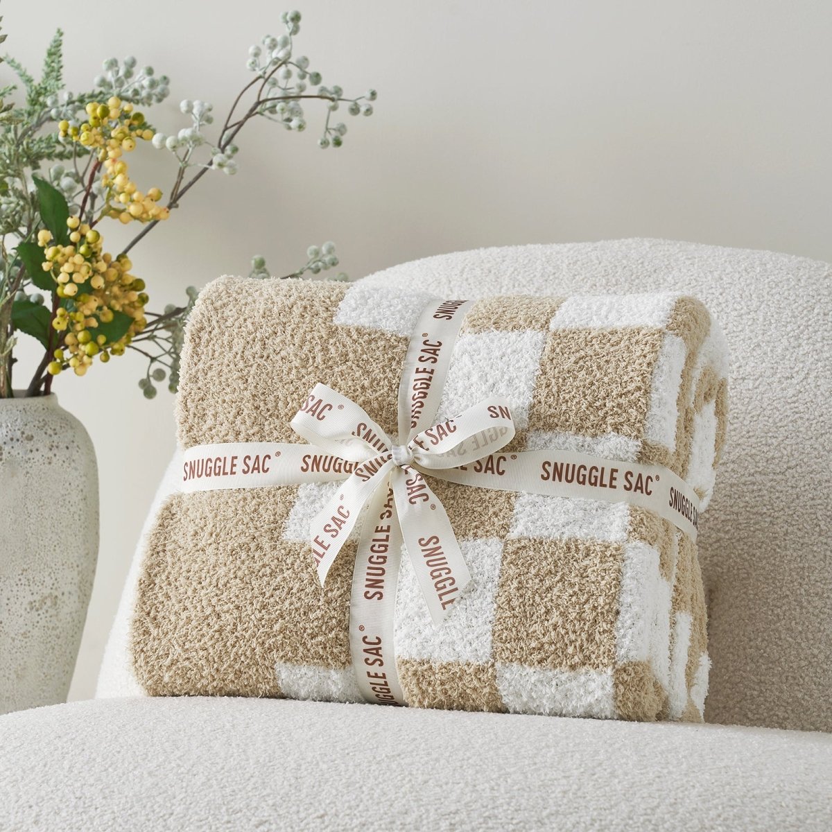 Checkered Feather Yarn Knit Throw Blanket in Beige & White neatly folded as gift packaging, perfect for home decor and gifting. #color_Beige & White