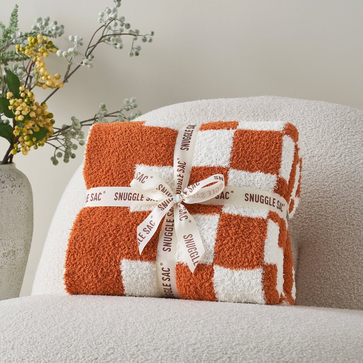 Checkered Feather Yarn Knit Throw Blanket in Burnt Orange neatly folded as gift packaging, ideal for gifting. #Color_Burnt Orange