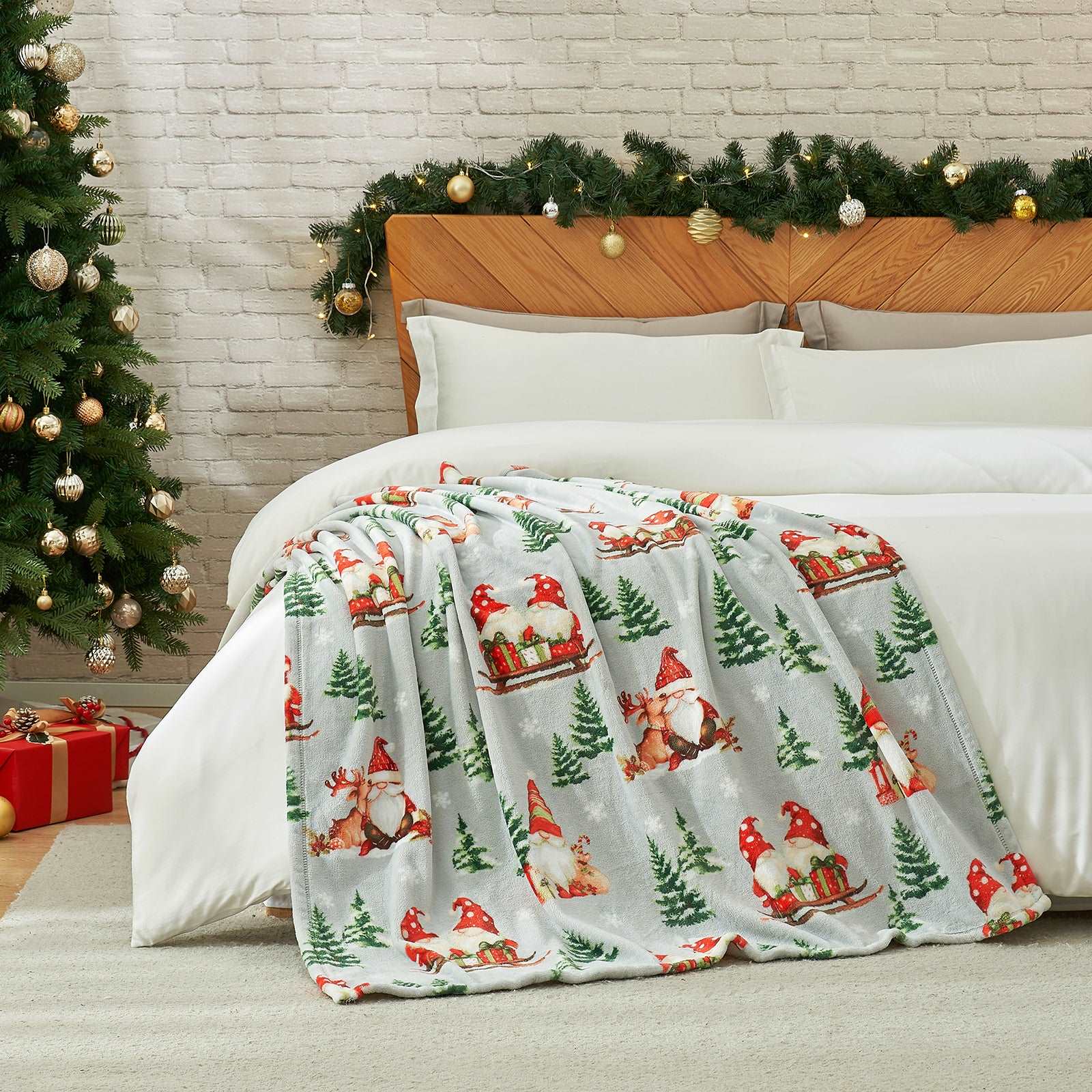 Gnomes MilkyPlush™ Throw Blanket on a bed, with a Christmas tree and decor. #color_ Gnome in Sleigh