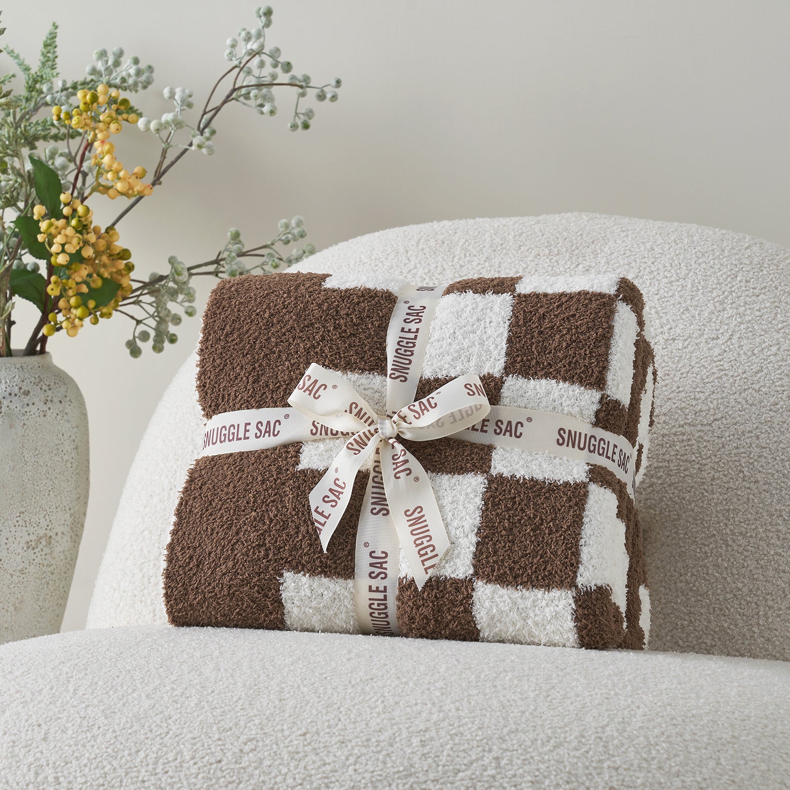 Checkered Feather Yarn Knit Throw Blanket in Brown neatly folded as gift packaging, ideal for holidays and special occasions. #color_Brown