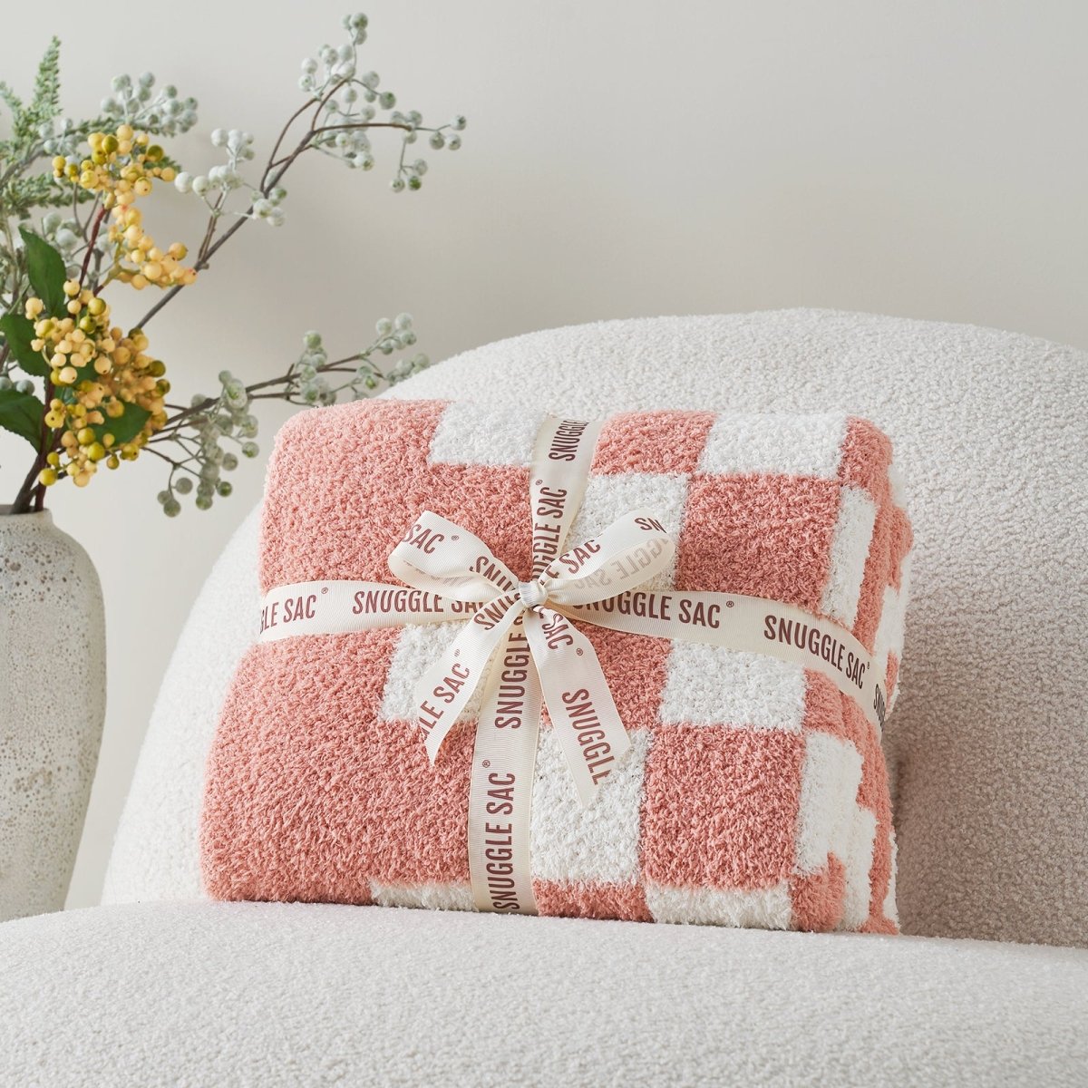Checkered Feather Yarn Knit Throw Blanket in Pink neatly folded as gift packaging, perfect for holidays and special occasions. #color_Pink White