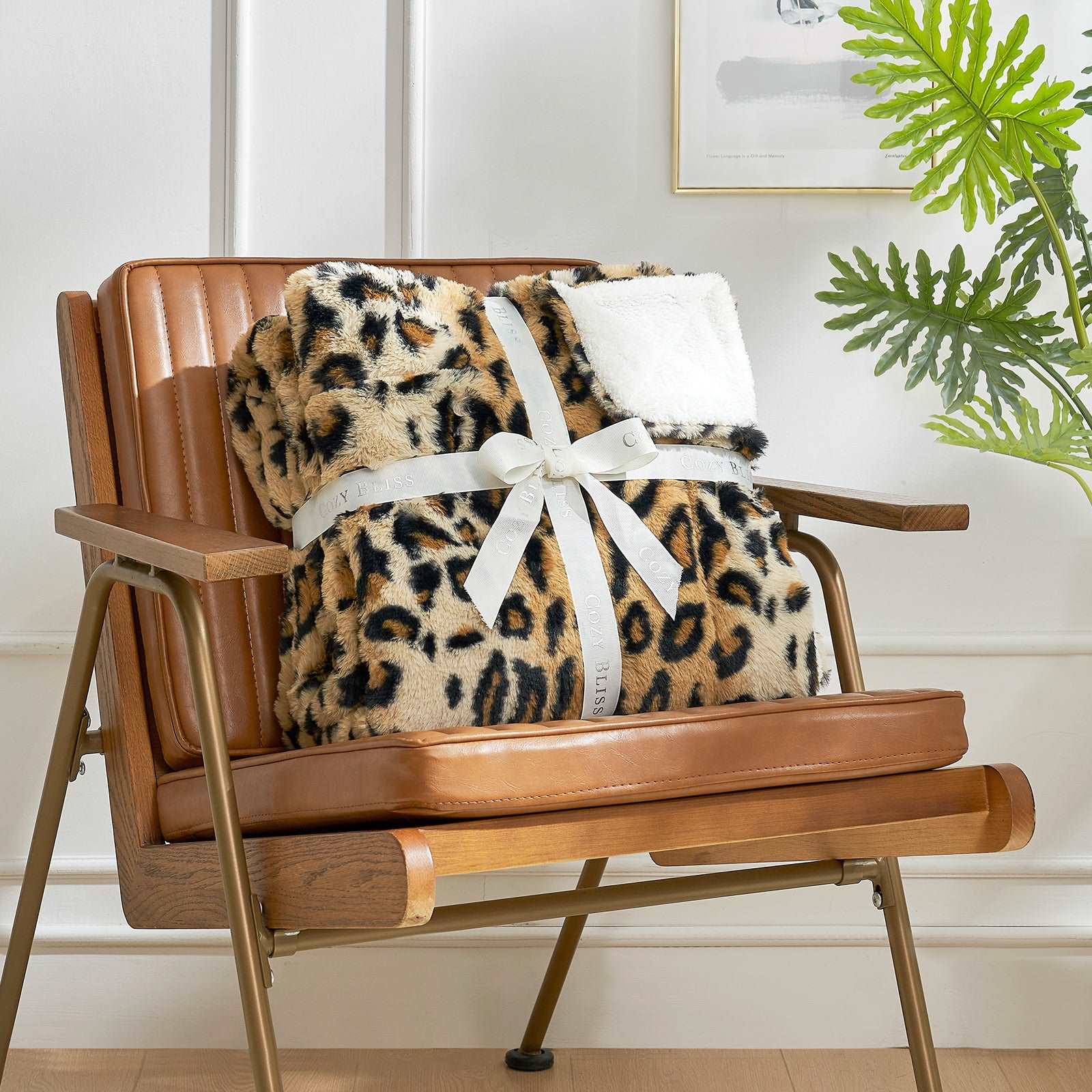 Leopard print faux fur blanket tied with ribbon on a chair #color_Brown Leopard