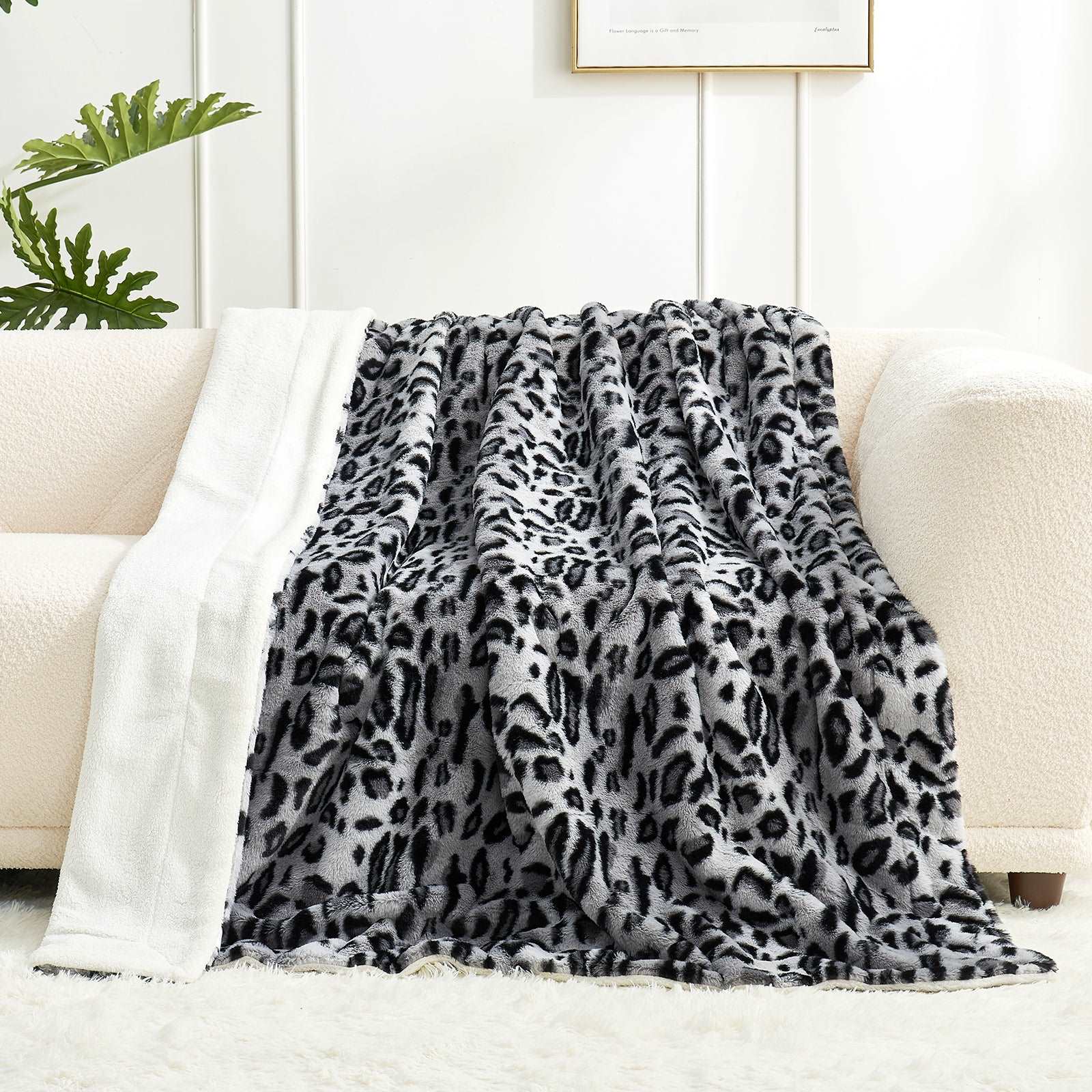 Leopard print faux fur blanket on a beige sofa #color_Snow Leopard