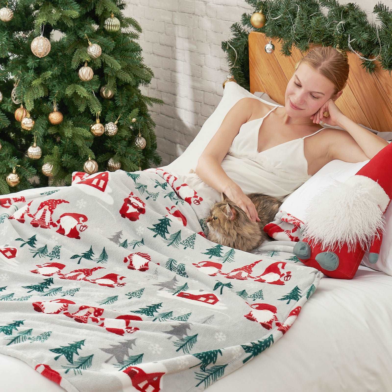 Woman relaxing with cat under Cozy Bliss Gnomes MilkyPlush blanket #color_ Gnome Family