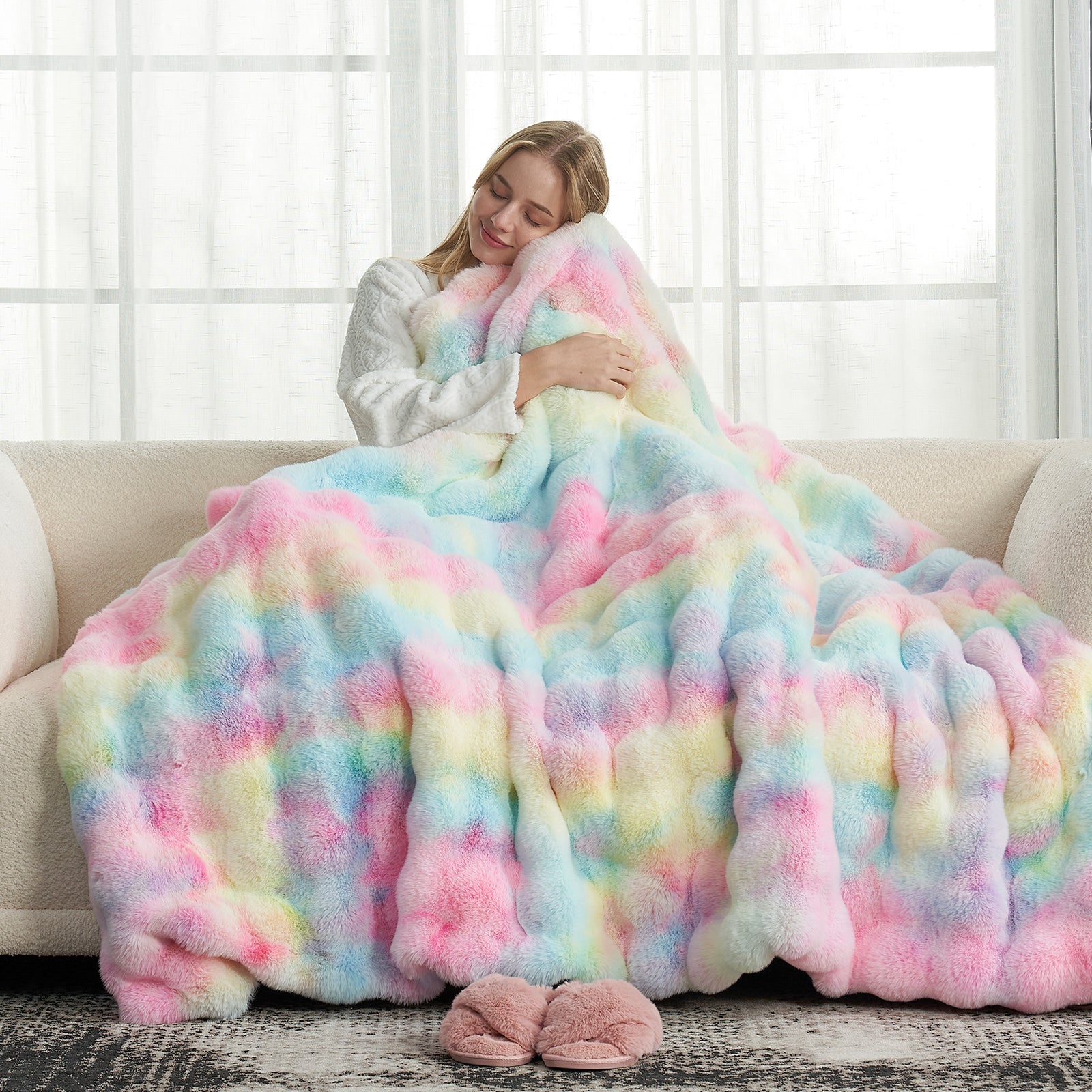 Woman relaxing with Cozy Bliss tie-dye faux fur throw blanket #color_Tie-dye Rainbow