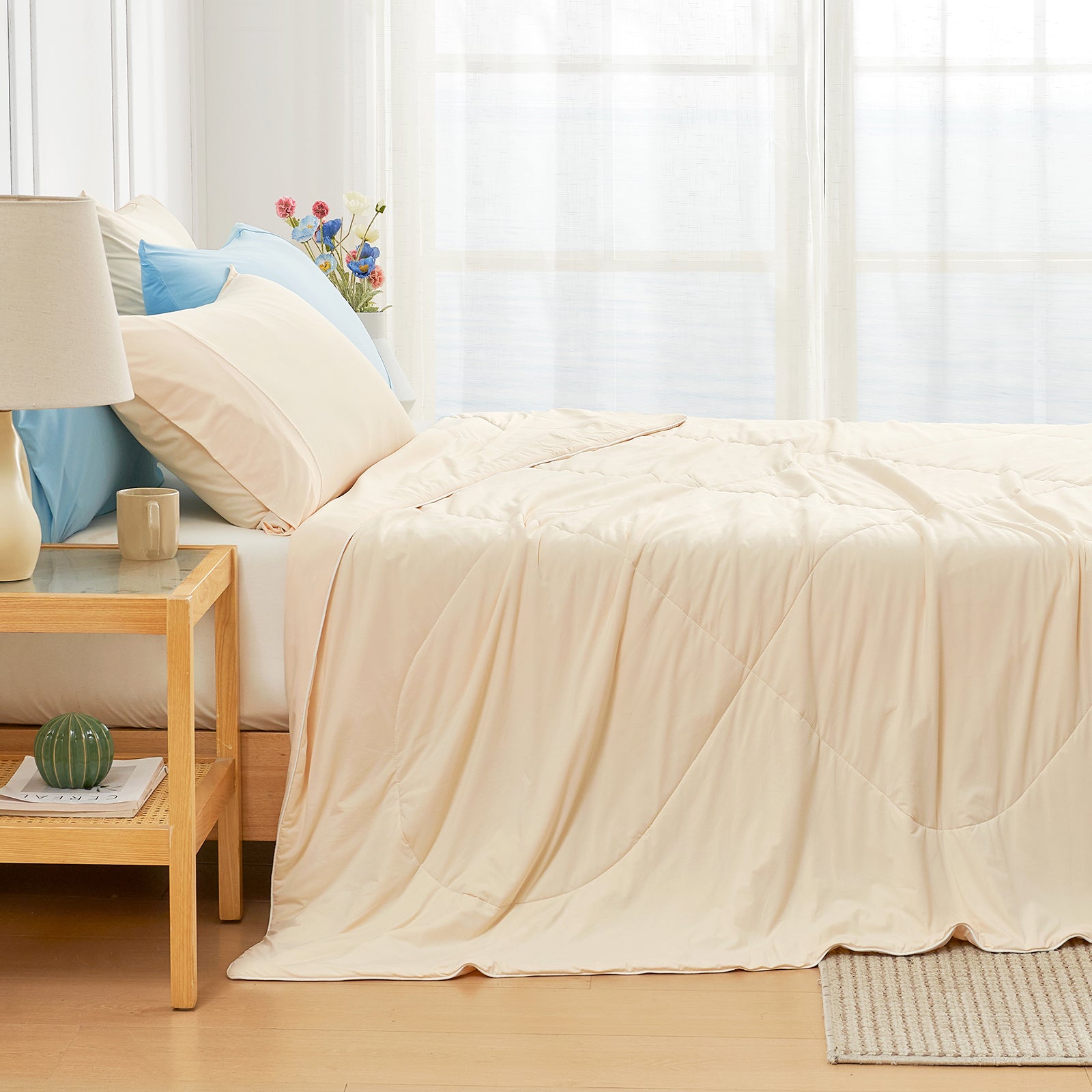 Light beige Cozy Bliss cooling comforter on a bed with pillows, breathable bedding for hot sleepers #Color_Yellow