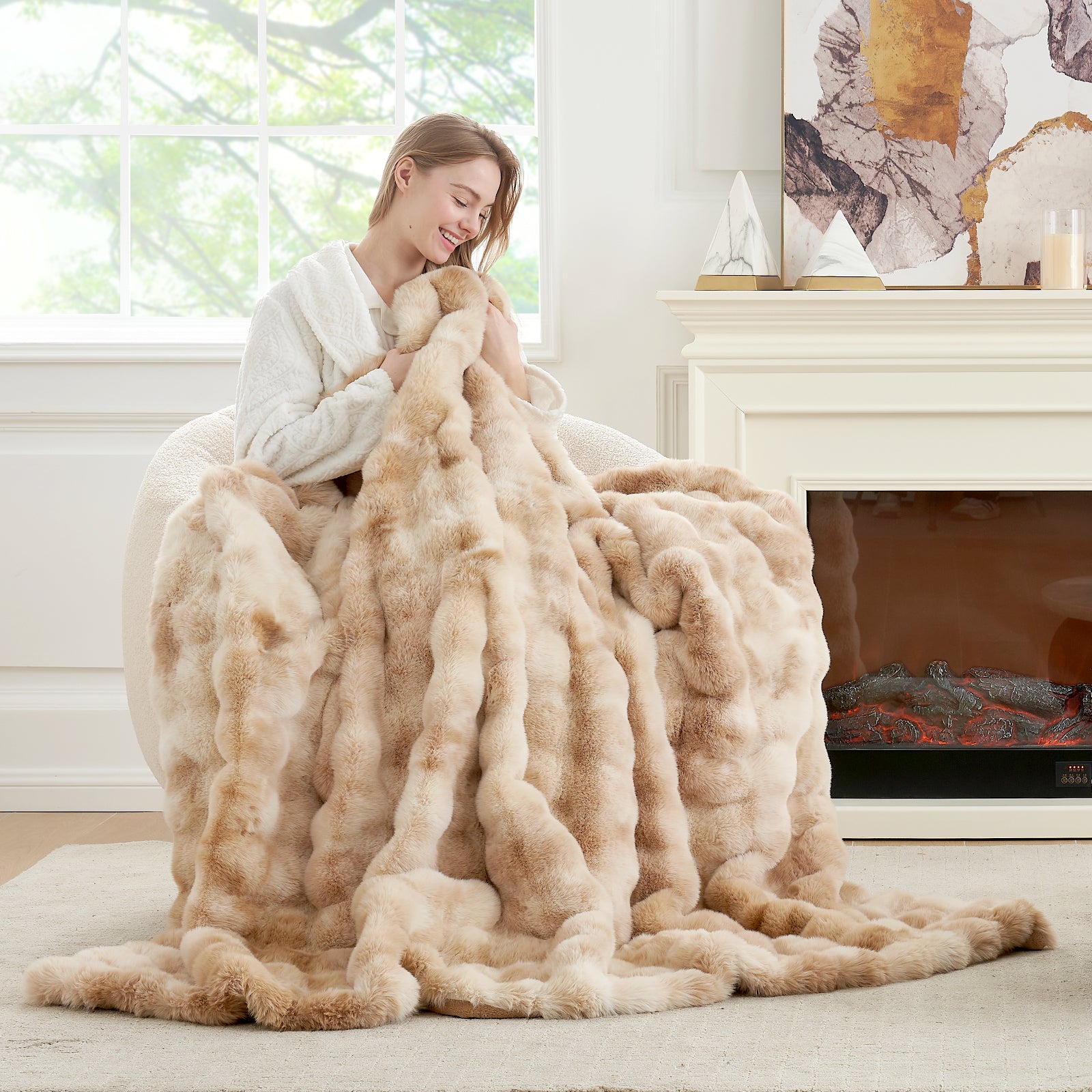 Woman enjoying a Cozy Bliss faux fur throw blanket. A soft and cozy blanket for comfortable lounging #Color_Tie-dye Beige