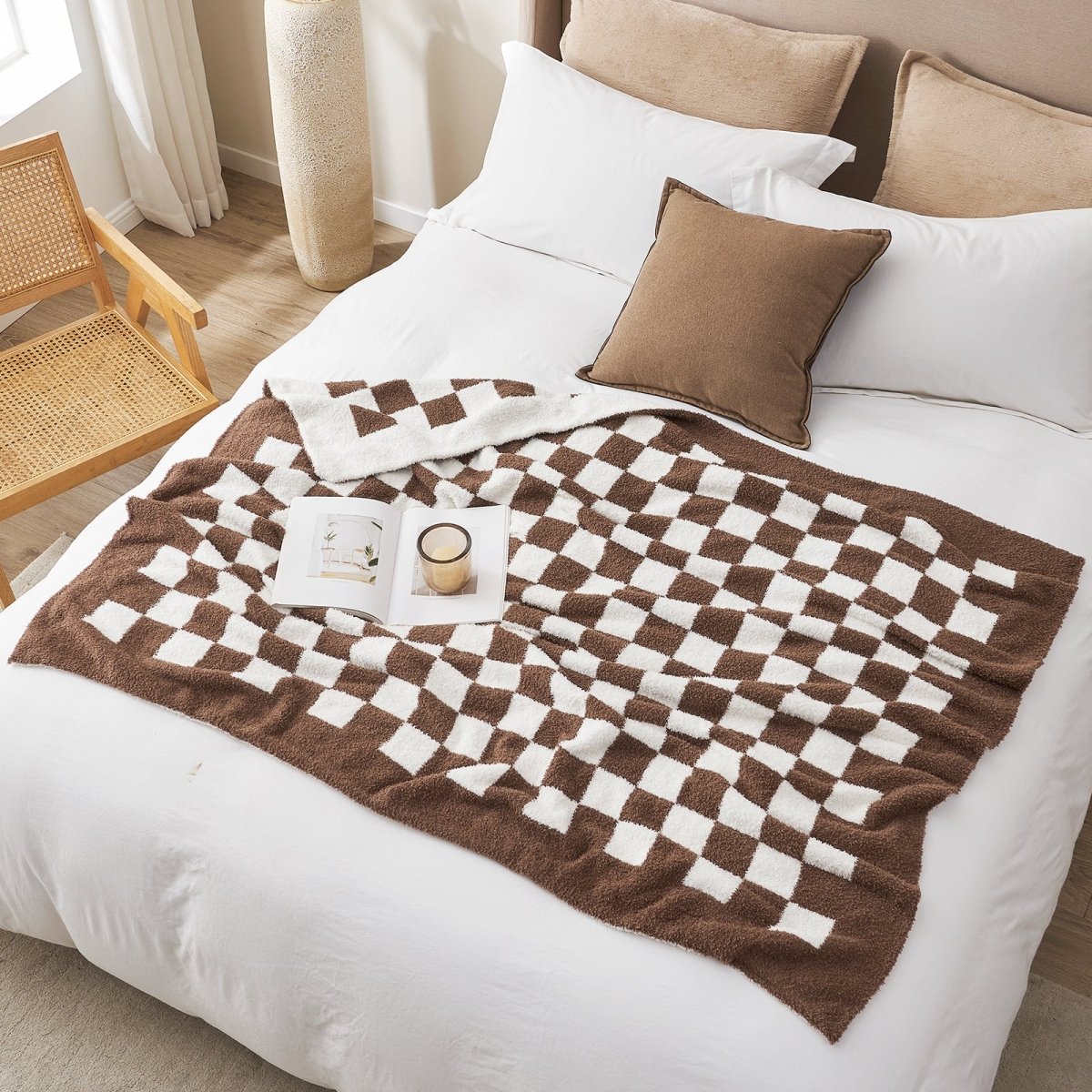 Checkered Feather Yarn Knit Throw Blanket in Brown styled on a bed in a comfortable bedroom. #color_Brown