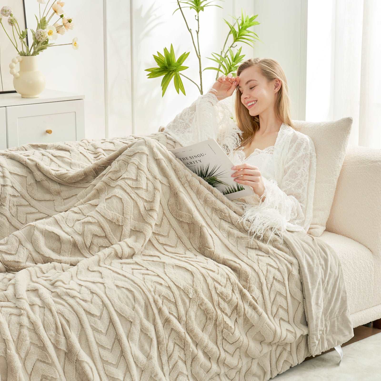 Woman relaxing under a cozy cable knit blanket #color_Khaki