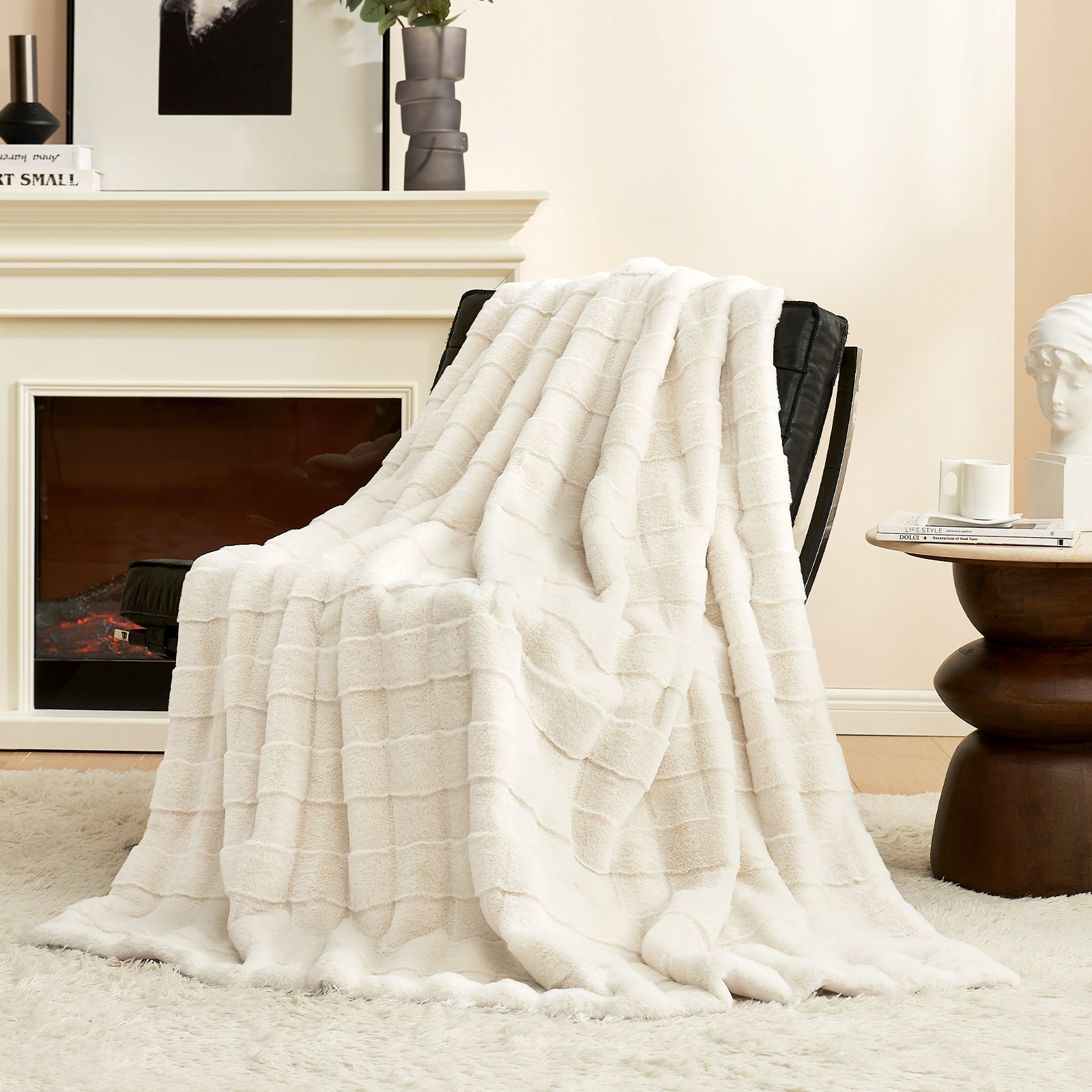 Cream faux fur throw blanket with cross-striped design on a black chair, for cozy home decor. #color_Cream White