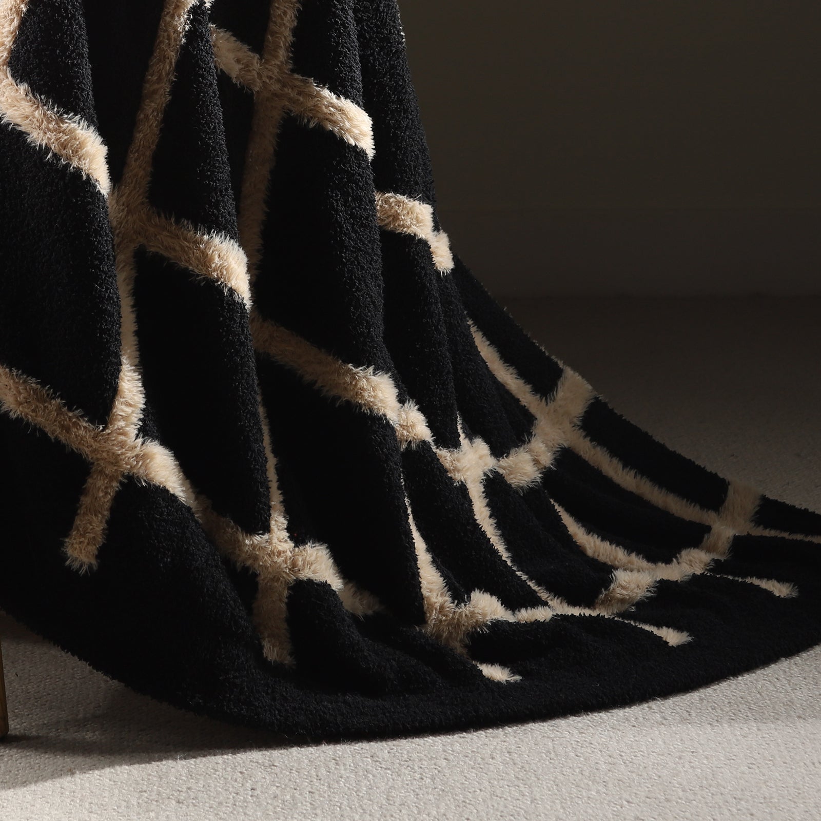 Close-up of faux mink texture on Faux Mink Textured Plaid Knit Throw Blanket in Black highlighting plush softness and cozy feel. #color_Black