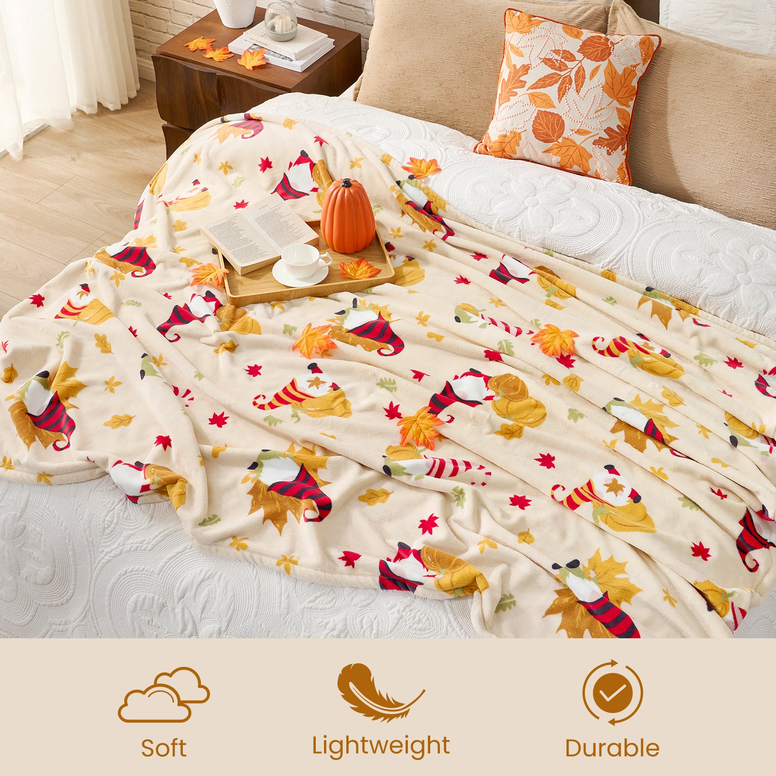 Decorative blanket with autumn-themed design on a bed, featuring soft, lightweight, and durable attributes.#color_Pumpkin Gnome