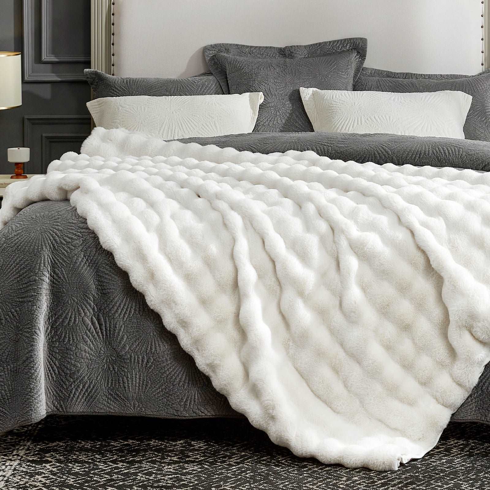 White bubble faux fur blanket on gray bed #color_Cream White
